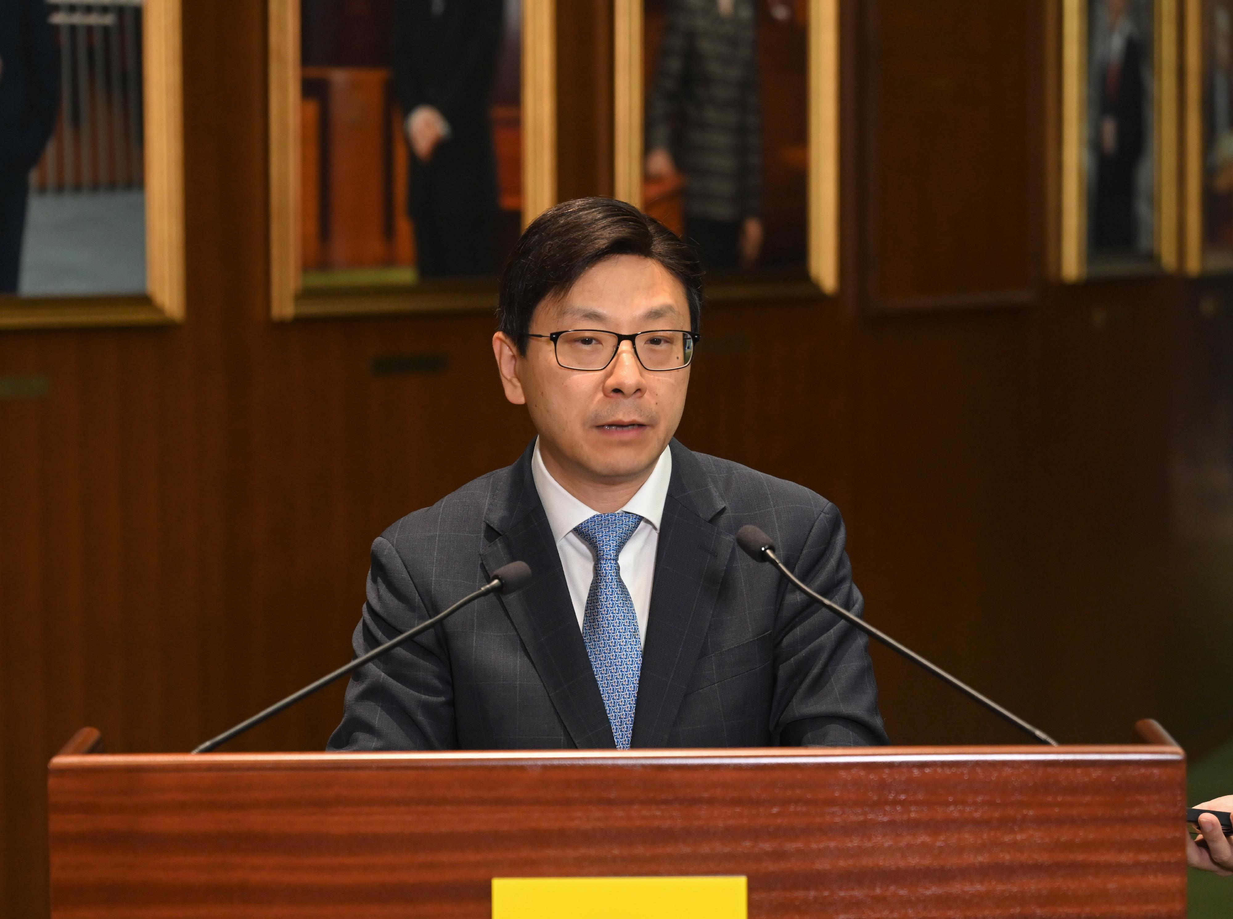 The Secretary for Labour and Welfare, Mr Chris Sun, meets the media after the passage of the Mandatory Reporting of Child Abuse Bill by the Legislative Council this afternoon (July 11).