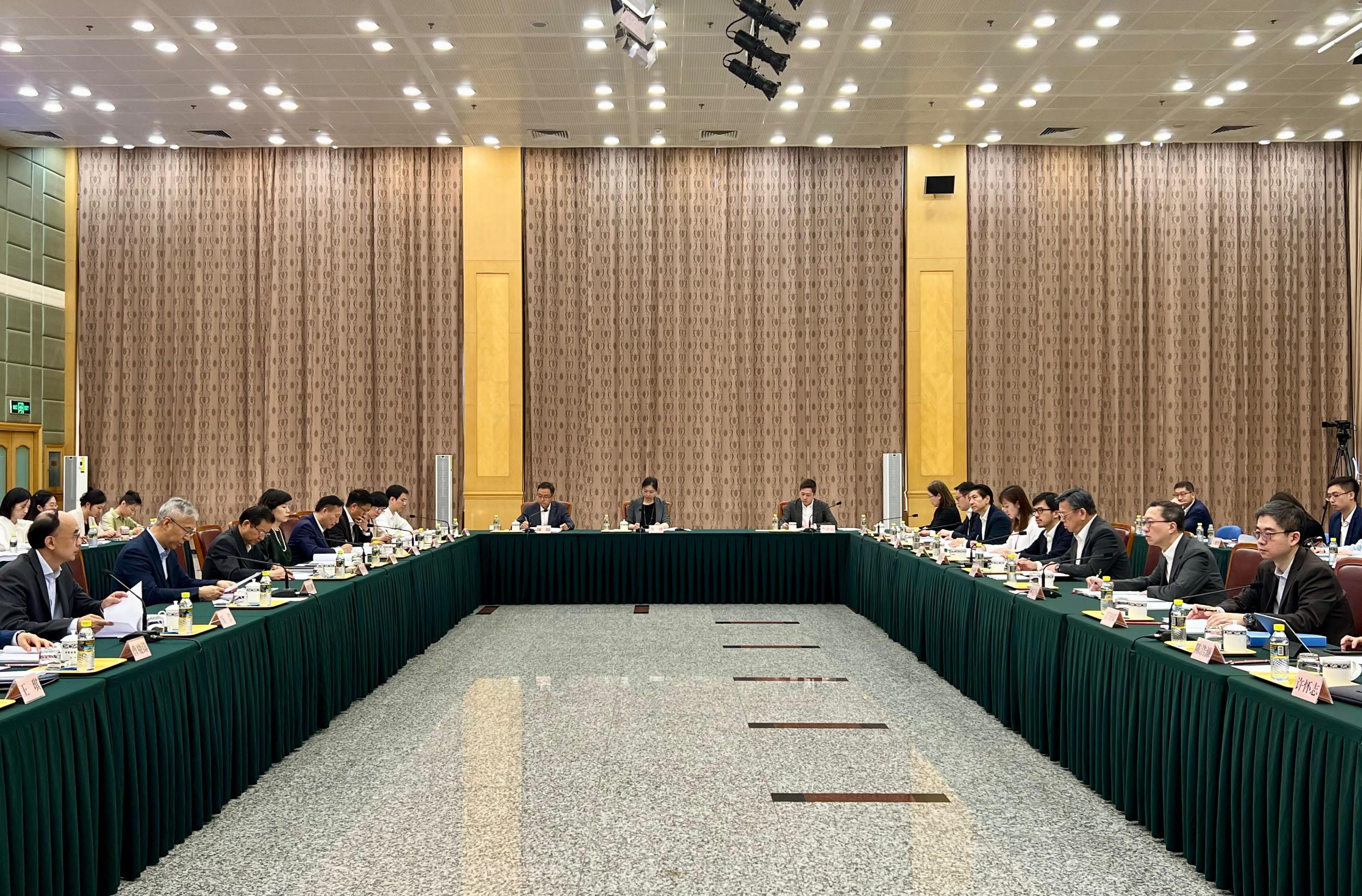 The Government of the Hong Kong Special Administrative Region (HKSAR), the National Development and Reform Commission (NDRC) and relevant central ministries held the seventh Joint Conference on Advancing Hong Kong's Full Participation in and Contribution to the Belt and Road Initiative in Beijing today (July 12). Photo shows Vice Chairman of the NDRC Mr Zhao Chenxin (second left); the Secretary General of the NDRC and Convenor of the Joint Conference, Mr Wu Hao (first left); the Secretary for Justice and chairperson of the Working Group on Belt and Road Development under the Steering Group on Integration into National Development, Mr Paul Lam, SC (second right); the Secretary for Commerce and Economic Development and Hong Kong-side Convenor of the Joint Conference, Mr Algernon Yau (third right), and other officials of central ministries and the HKSAR Government at the conference.