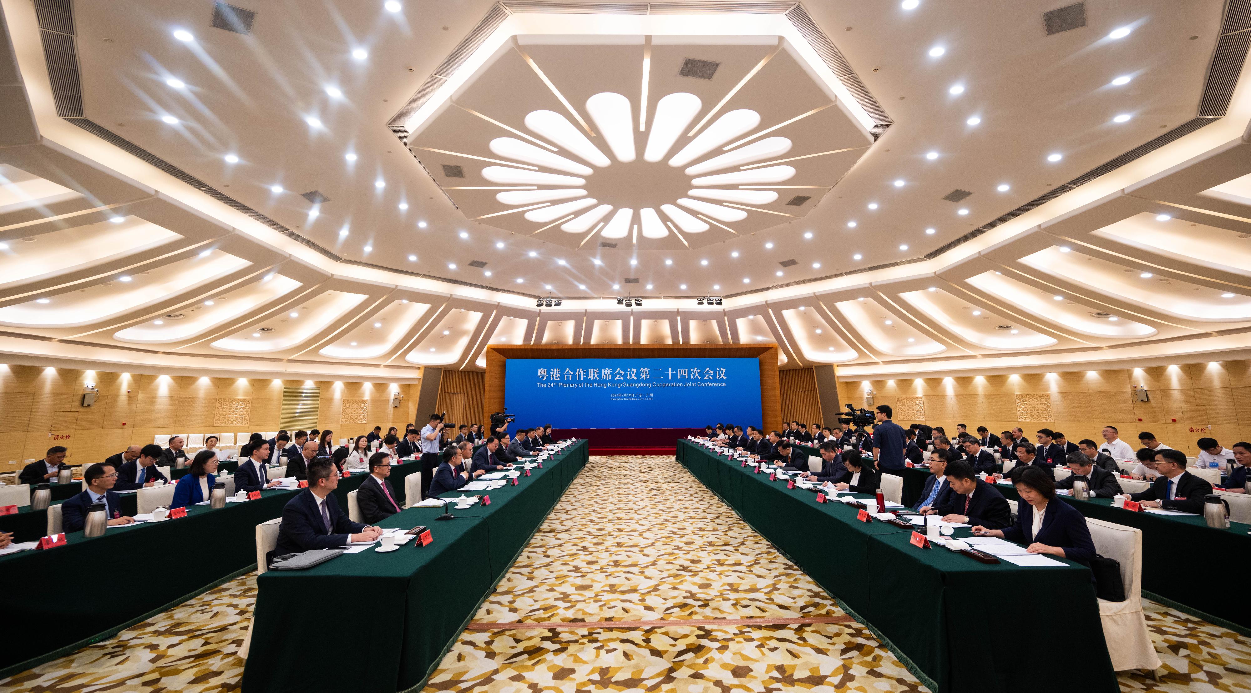 The Chief Executive, Mr John Lee, led a Hong Kong Special Administrative Region Government delegation to attend the 24th Plenary of the Hong Kong/Guangdong Co-operation Joint Conference in Guangzhou today (July 12). Photo shows Mr Lee (sixth left) and the Governor of Guangdong Province, Mr Wang Weizhong (seventh right), co-chairing the Plenary. Also joining the meeting are the officials from both sides.