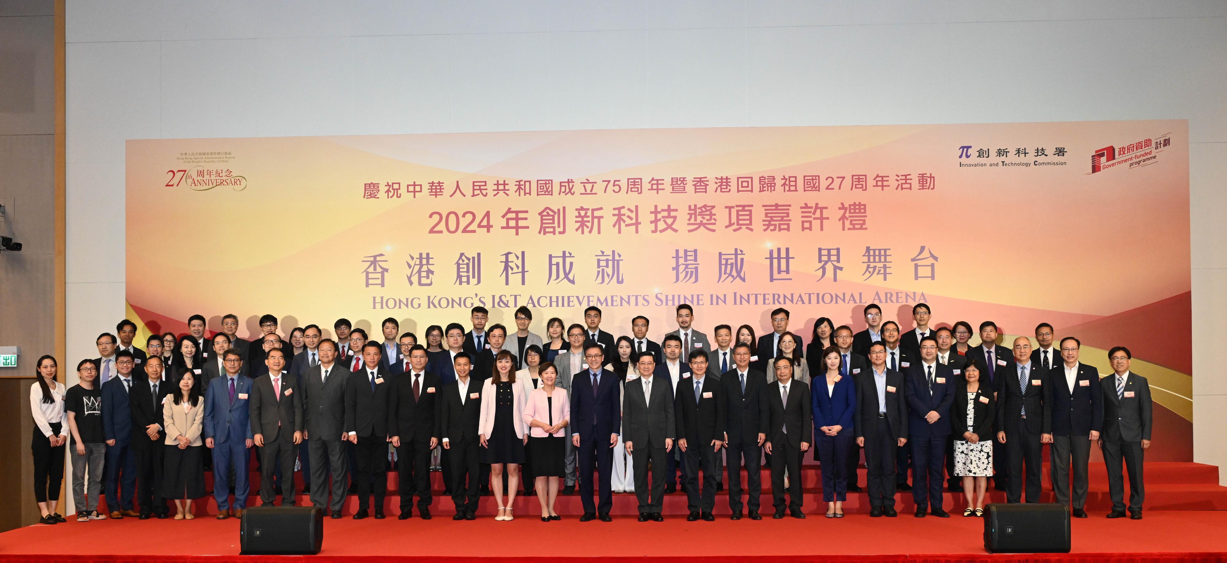 The Chief Executive, Mr John Lee, attended the Reception for I&T Awards 2024 today (July 15). Photo shows (front row, from 14th left) the Secretary for Innovation, Technology and Industry, Professor Sun Dong; Mr Lee; the Director-General of the Department of Educational, Scientific and Technological Affairs of the Liaison Office of the Central People's Government in the Hong Kong Special Administrative Region, Dr Wang Weiming; the Permanent Secretary for Innovation, Technology and Industry, Mr Eddie Mak; and the Commissioner for Innovation and Technology, Mr Ivan Lee; with guests, representatives of award-winning projects of universities and representatives of universities at the reception.