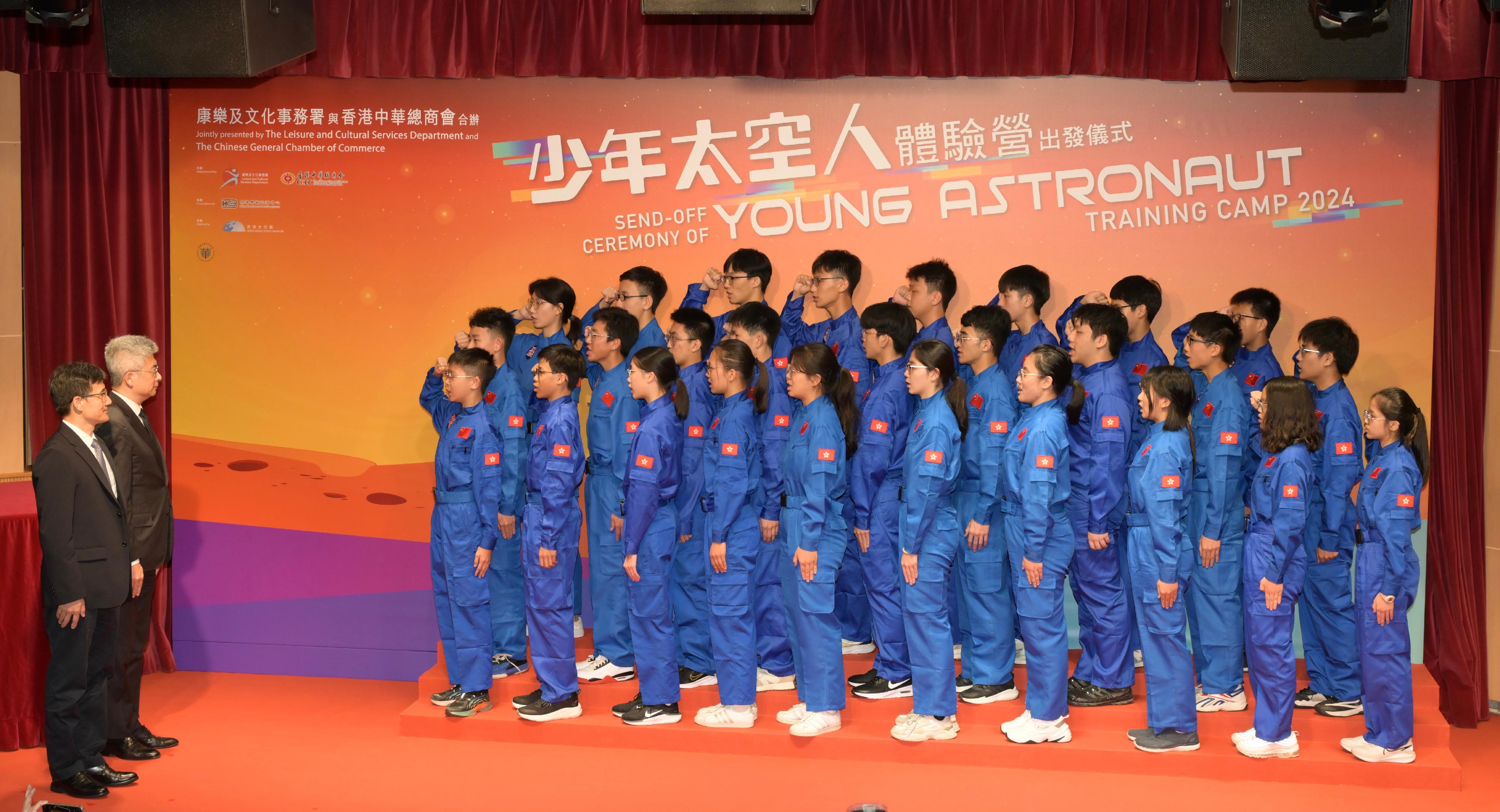 A send-off ceremony for the Young Astronaut Training Camp 2024 was held at the Hong Kong Space Museum today (July 16). Photo shows the Director-General of the Department of Educational, Scientific and Technological Affairs of the Liaison Office of the Central People's Government in the Hong Kong Special Administrative Region, Dr Wang Weiming (first left), and the Under Secretary for Culture, Sports and Tourism, Mr Raistlin Lau (second left), witnessing the oath-taking by the Young Astronauts. The Young Astronauts will set off on July 26.