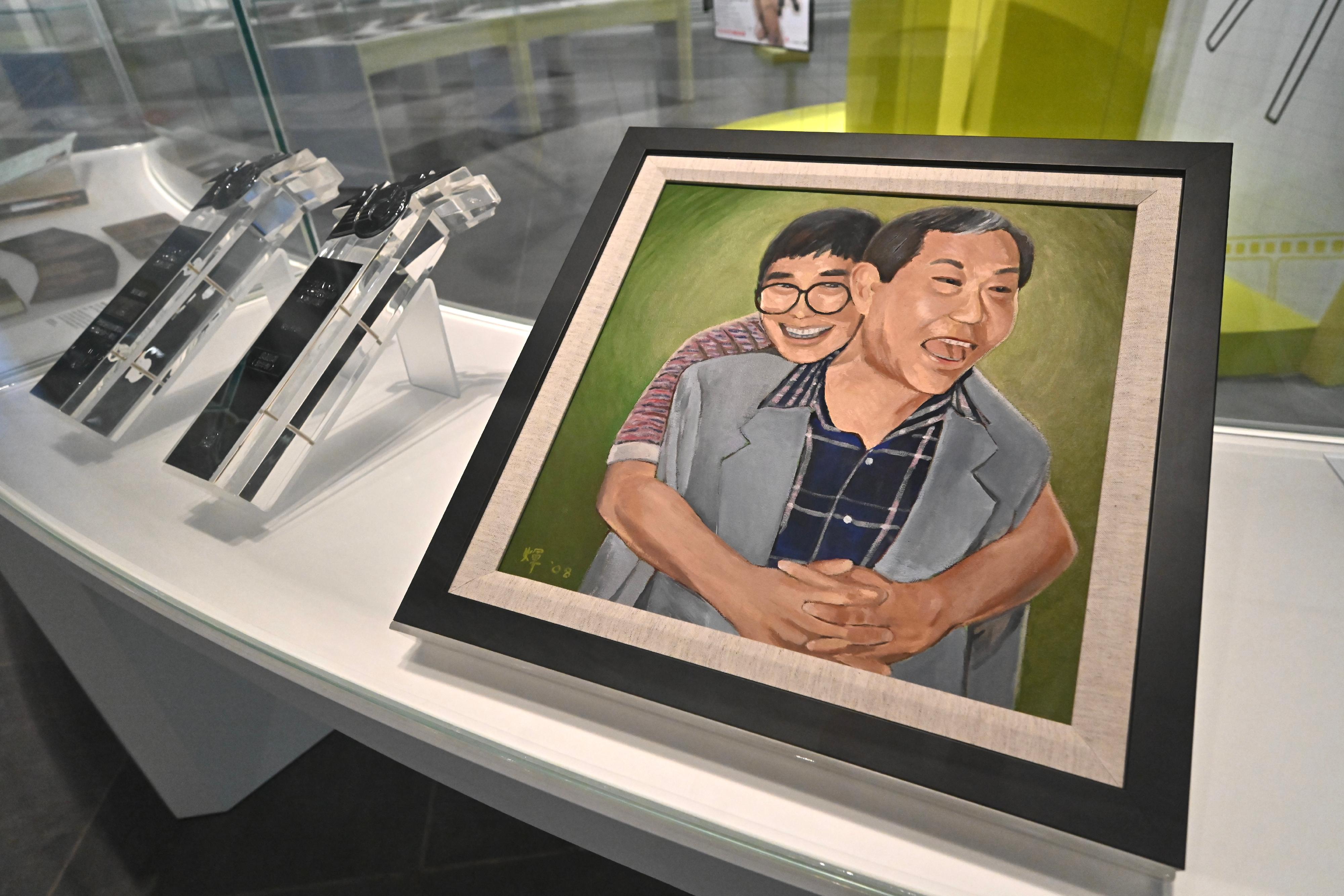 The opening ceremony for the "A Laugh at the World: James Wong" exhibition was held today (July 16) at the Hong Kong Heritage Museum. Photo shows the painting of Joseph Koo and Wong painted by Koo based on a photograph of the pair.