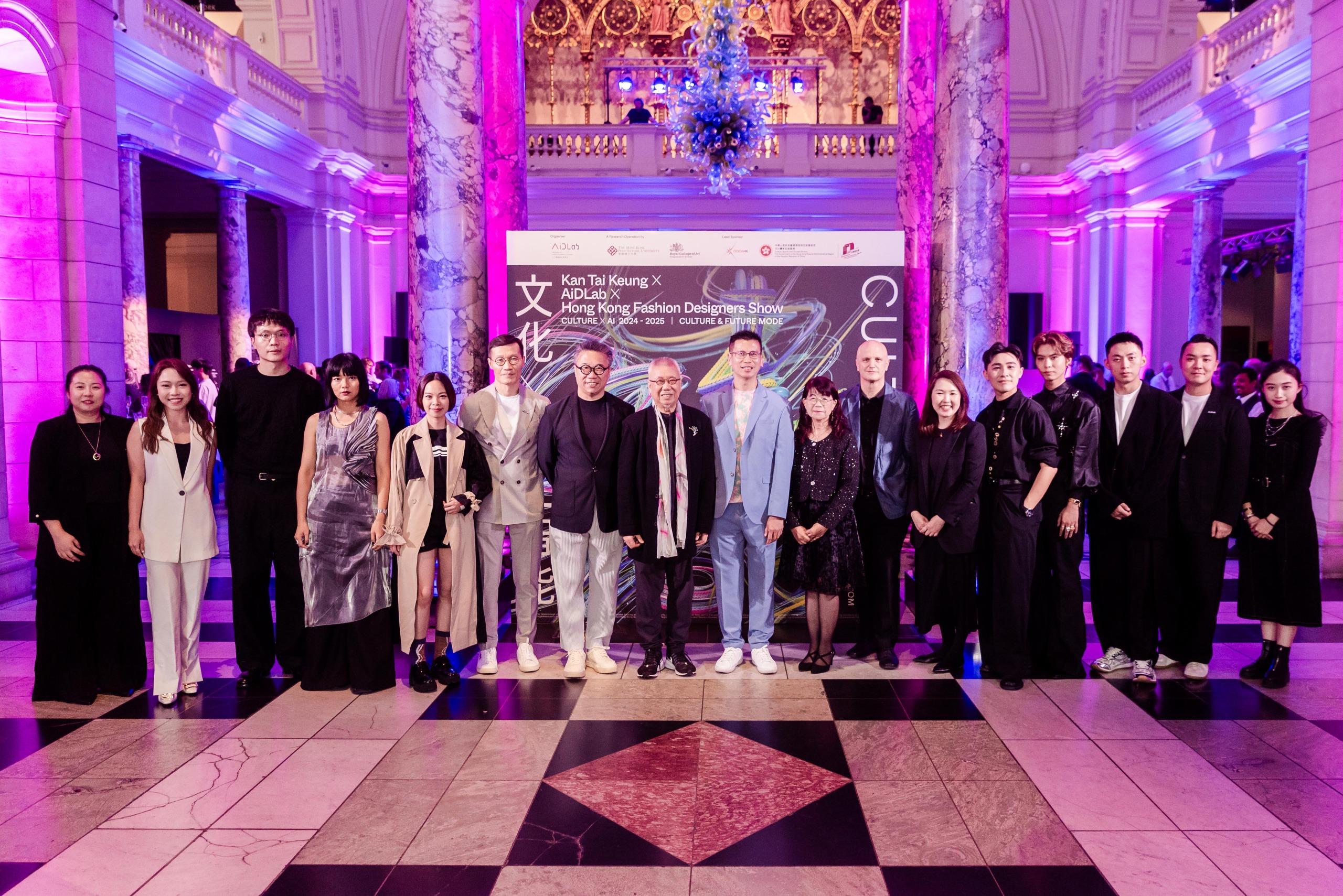 The Hong Kong Economic and Trade Office, London (London ETO) and the Cultural and Creative Industries Development Agency supported the Culture X AI 2024-2025: Kan Tai Keung X AiDLab X Hong Kong Fashion Designers Show on 17 July (London time) at the Victoria and Albert Museum, the United Kingdom. Photo shows (from sixth left) the Centre Director of AiDLab, Mr Calvin Wong; the Chairman of Hong Kong Design Centre, Mr Eric Yim; the renowned design master and ink painter, Dr Kan Tai-keung; the Director-General of the London ETO, Mr Gilford Law; the Assistant Commissioner for Cultural and Creative Industries, Mrs Lowell Cho; the President and Vice-Chancellor of the Royal College of Art, Professor Christoph Lindner; the Professor of School of Fashion and Textiles of the Hong Kong Polytechnic University, Professor Jeanne Tan; and Hong Kong fashion designers at the show.  