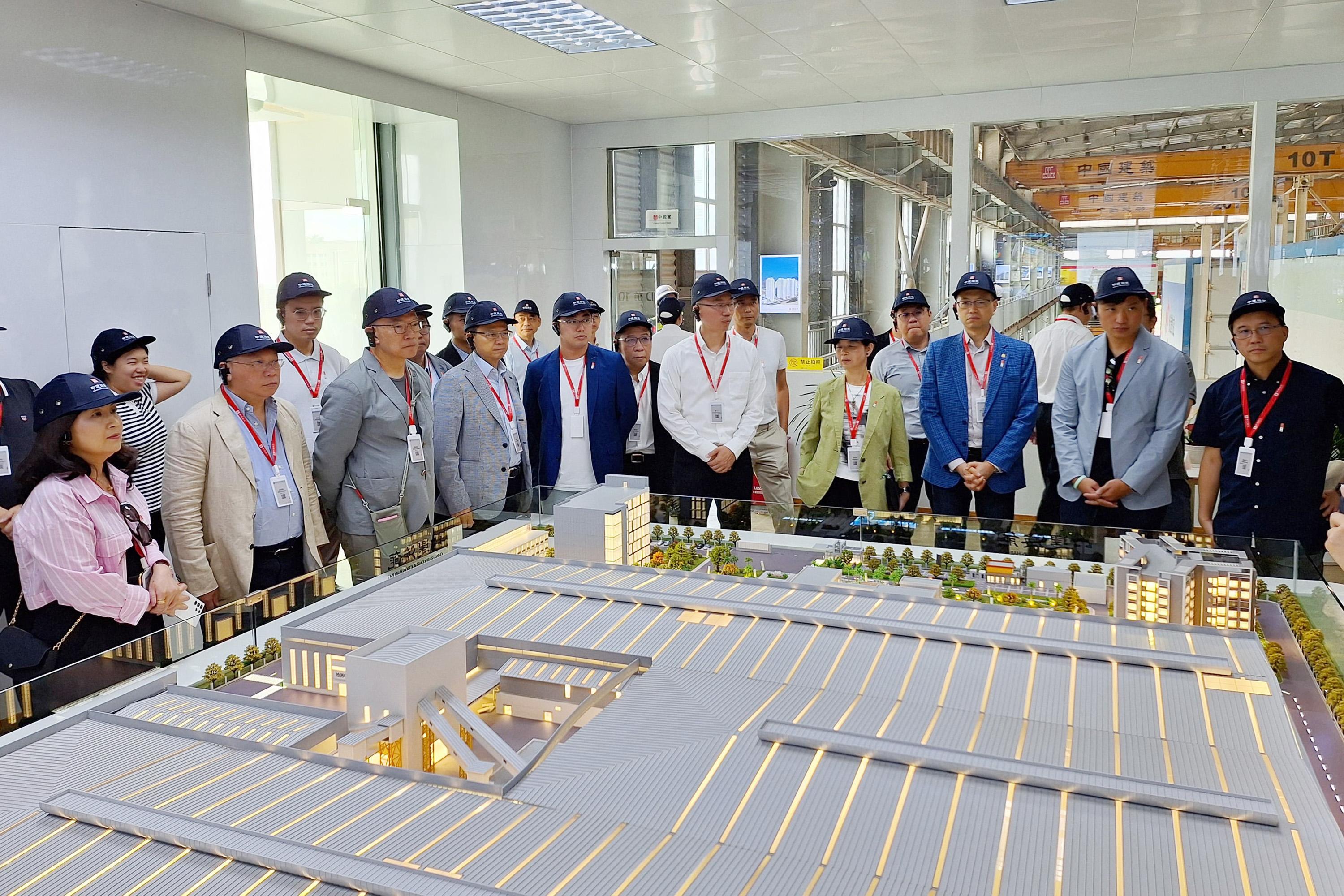 The delegation of the Legislative Council (LegCo) Panel on Housing began the two-day visit today (July 21). Photo shows the delegation visiting the factory of the China State Construction Hailong Technology Company Limited.