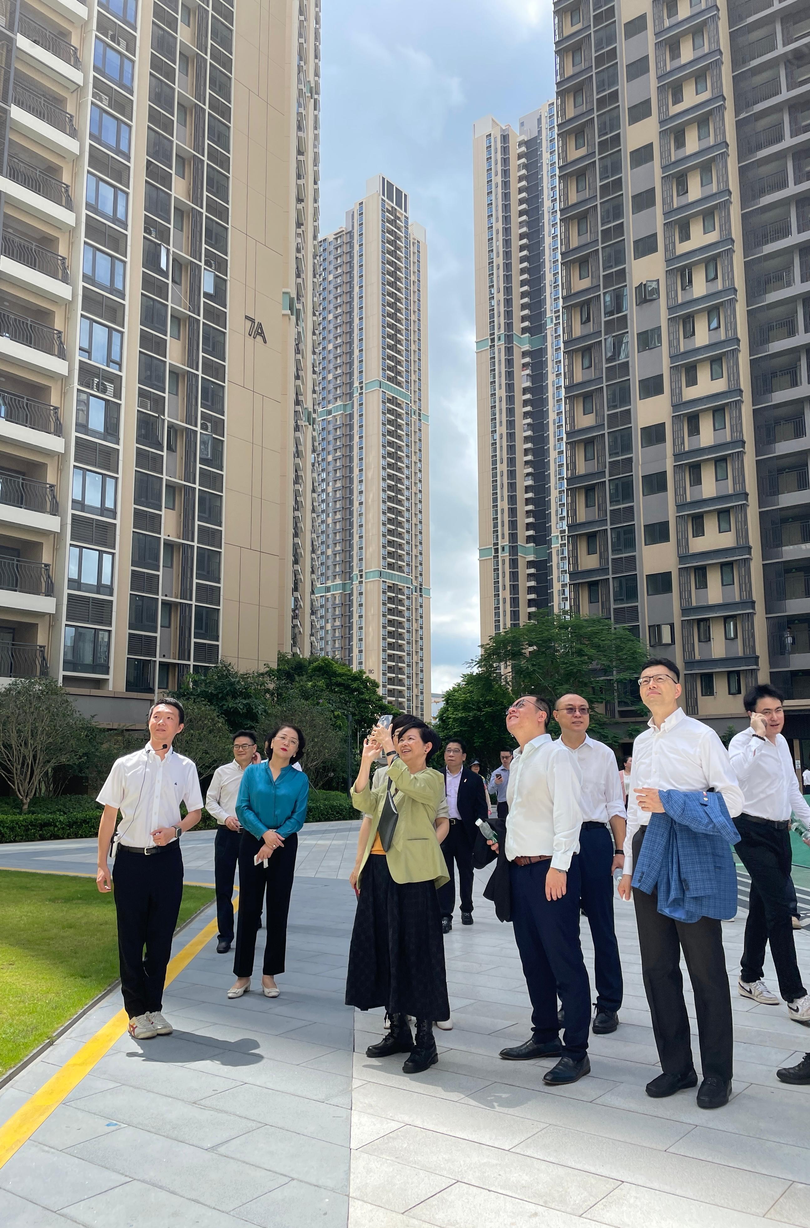 The Secretary for Housing, Ms Winnie Ho, together with a delegation from the Housing Department and the Legislative Council (LegCo) Panel on Housing, continued their visit to Shenzhen today (July 22). Photo shows Ms Ho (third left) and the Chairman of the LegCo Panel on Housing, Mr Stanley Ng (first right), touring the public rental housing project Phoenix Yinghui Town.