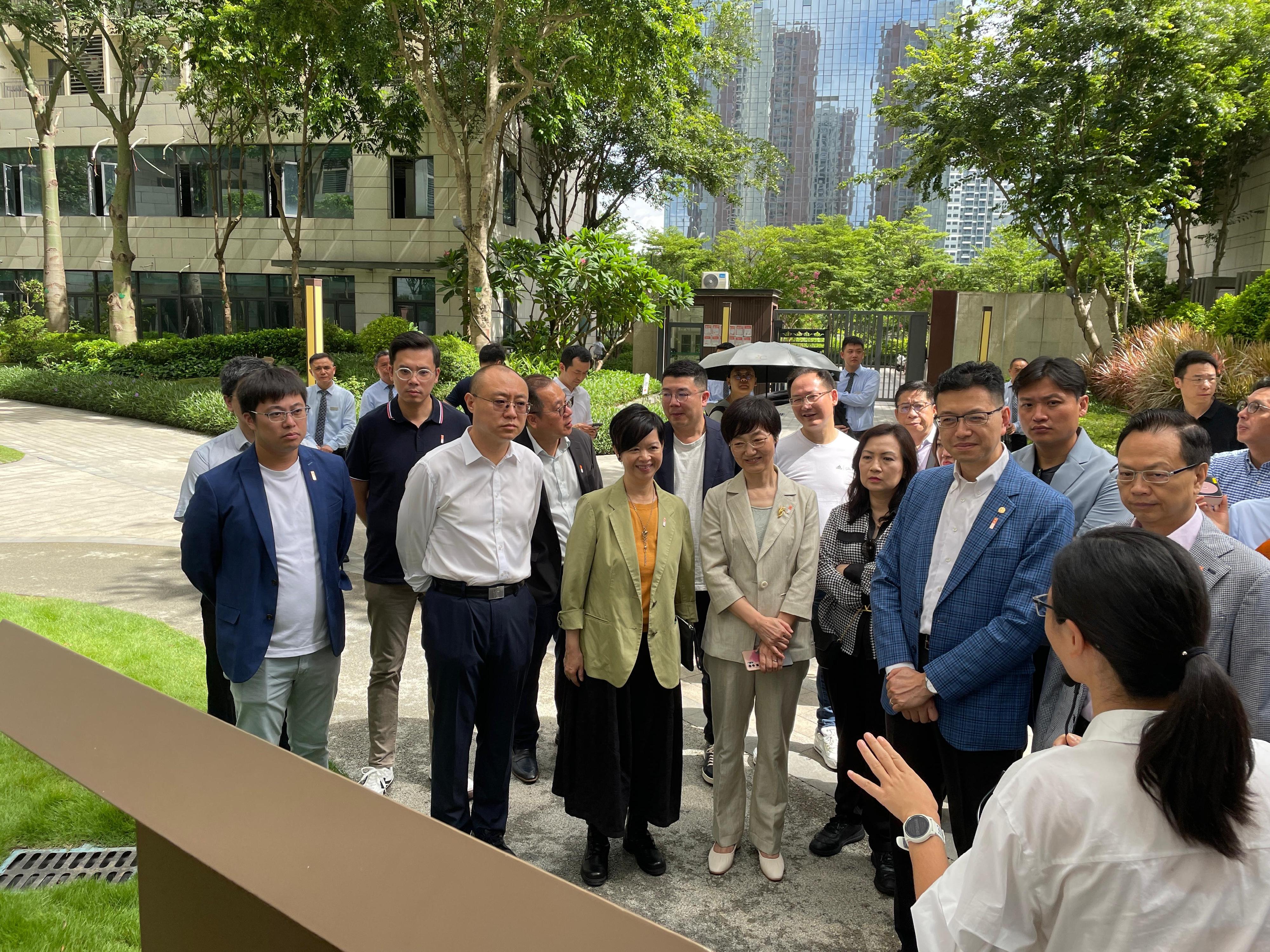 The Secretary for Housing, Ms Winnie Ho, together with a delegation of the Housing Department and the Legislative Council (LegCo) Panel on Housing, continued their visit to Shenzhen today (July 22). Photo shows Ms Ho (front row, third left) and the Chairman of the LegCo Panel on Housing, Mr Stanley Ng (front row, second right), accompanied by the Director-General of the Department of Housing and Urban-Rural Development of Guangdong Province, Mr Zhang Yong (front row, second left), and the Director of the Housing Indemnification Division, Housing and Construction Bureau of Shenzhen Municipality, Ms Qiu Yingying (front row, fourth left), touring the public rental housing project Guangqiao Yayuan.