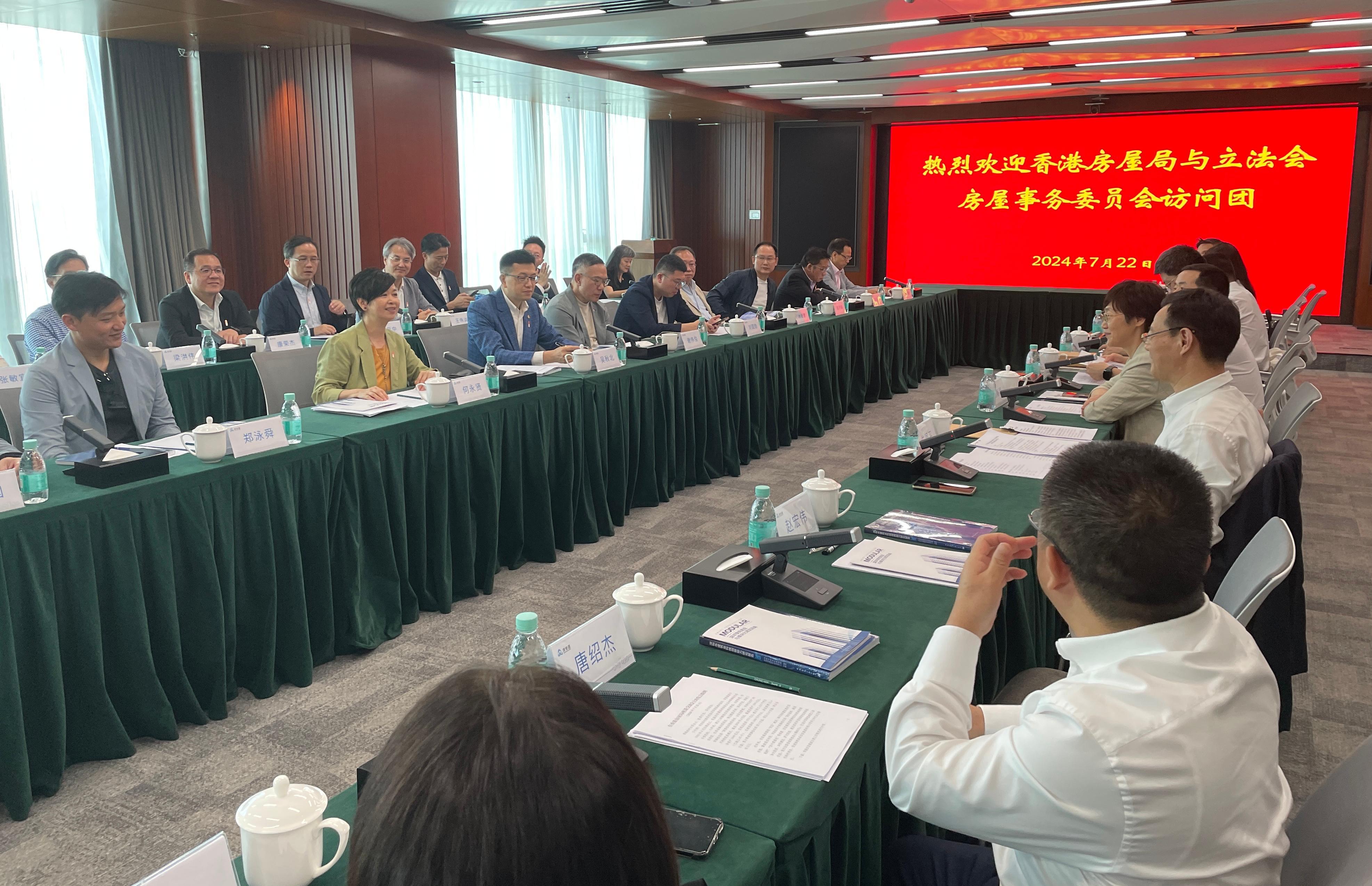 The Secretary for Housing, Ms Winnie Ho, together with a delegation of the Housing Department and the Legislative Council (LegCo) Panel on Housing, continued their visit to Shenzhen today (July 22). Photo shows Ms Ho (front left row, second left) and the Chairman of the LegCo Panel on Housing, Mr Stanley Ng (front left row, third left), meeting with the Party Secretary and Director-General of the Housing and Construction Bureau of Shenzhen Municipality, Mr Zhu Enping (second right).