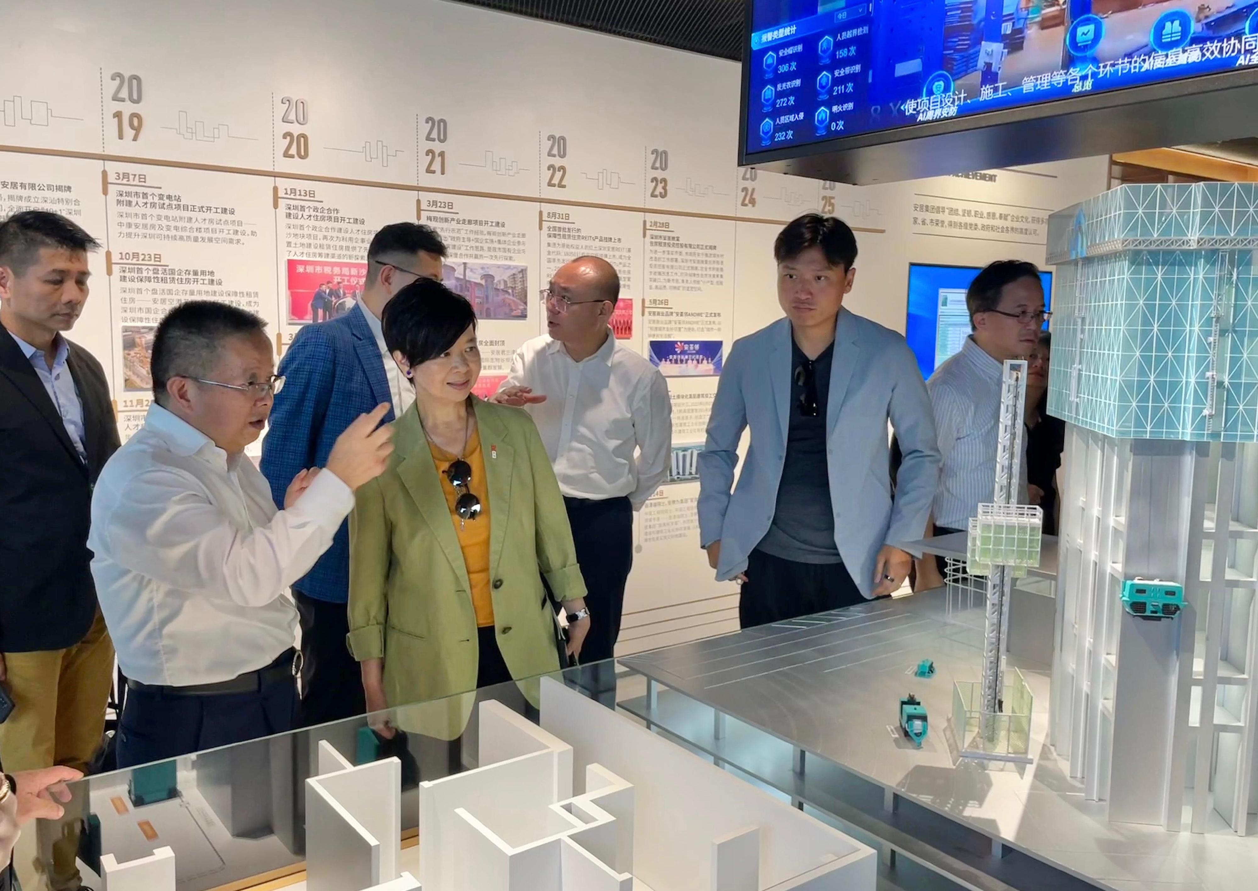 The Secretary for Housing, Ms Winnie Ho, together with a delegation from the Housing Department and the Legislative Council (LegCo) Panel on Housing, continued their visit to Shenzhen today (July 22). Photo shows Ms Ho (third left) visiting Shenzhen Indemnificatory Housing Exhibition Hall.