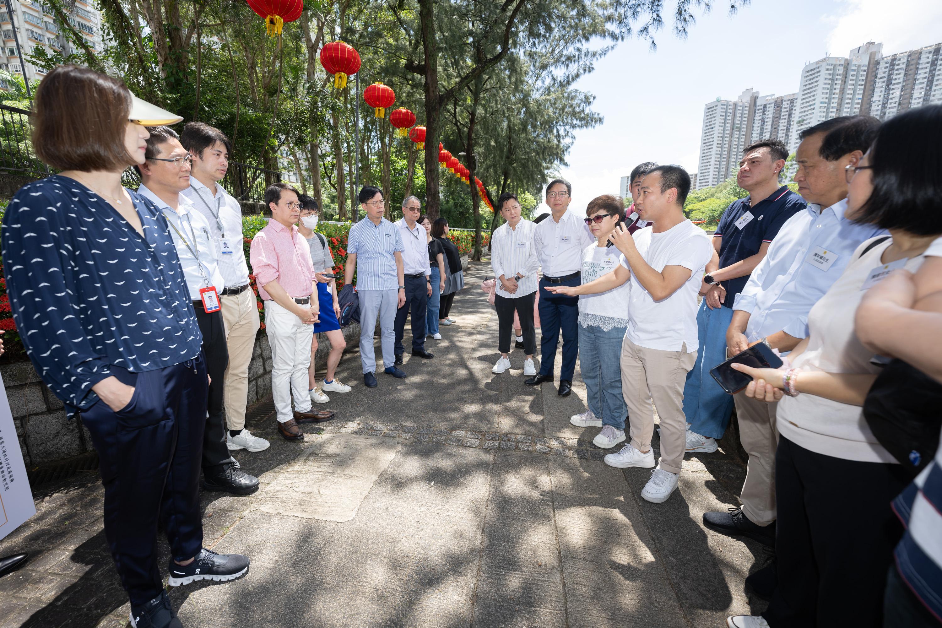 The Legislative Council (LegCo) Members and Tai Po District Council (DC) members visit Lam Tsuen River and Kwong Fuk Bridge in Tai Po today (July 23).  Photos shows LegCo Members receiving a briefing by representatives of Tai Po DC and relevant government departments on the old and new facilities of Lam Tsuen River.