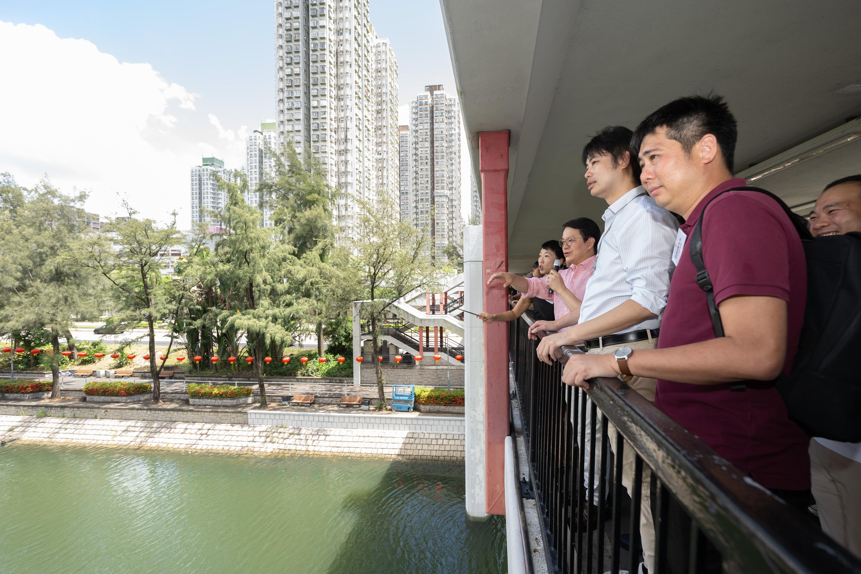 The Legislative Council (LegCo) Members and Tai Po District Council (DC) members visit Lam Tsuen River and Kwong Fuk Bridge in Tai Po today (July 23).  Photos shows LegCo Members and Tai Po DC members visiting Kwong Fuk Bridge along Lam Tsuen River.