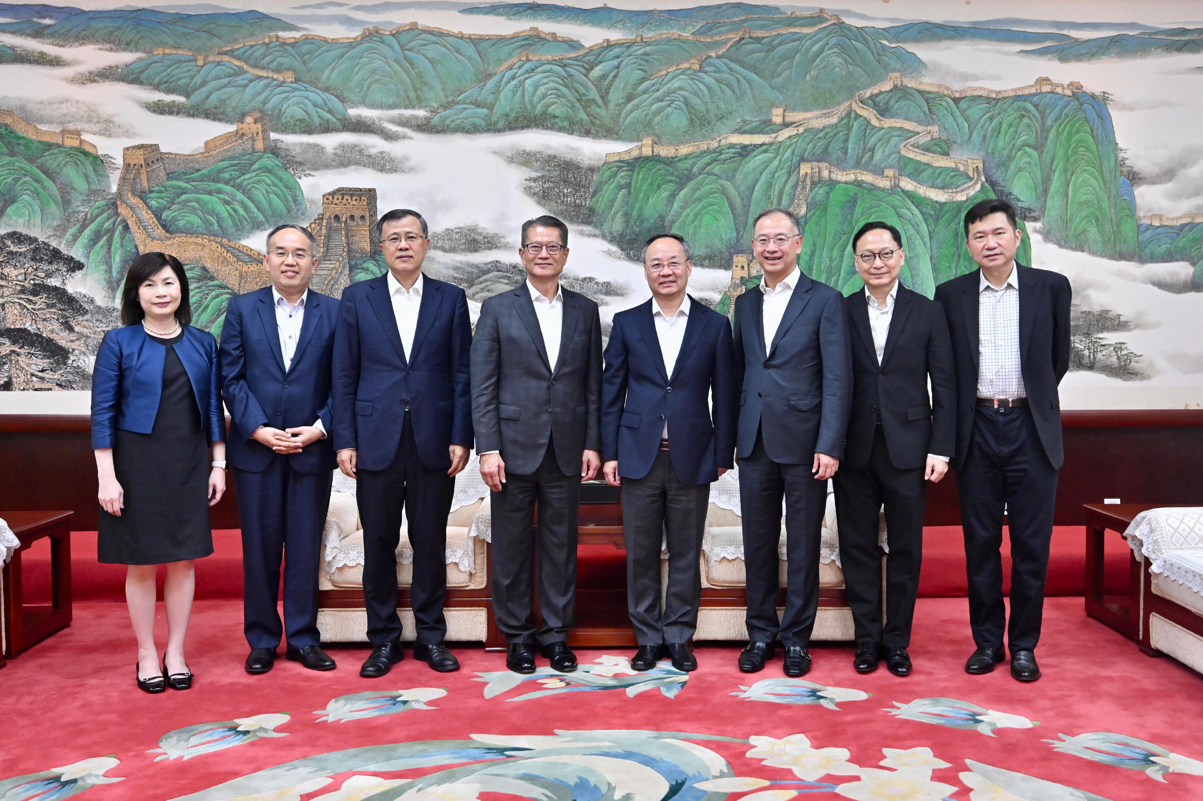 The Financial Secretary, Mr Paul Chan, began his visit programme to Beijing today (July 23). Photo shows Mr Chan (fourth left) meeting with the Minister of the National Financial Regulatory Administration, Mr Li Yunze (fourth right). The Secretary for Financial Services and the Treasury, Mr Christopher Hui (second left); the Chief Executive of the Hong Kong Monetary Authority, Mr Eddie Yue (third right); the Chief Executive Officer of the Insurance Authority, Mr Clement Cheung (second right); and the Acting Chief Executive Officer of the Securities and Futures Commission, Ms Christina Choi (first left), are also in attendance.