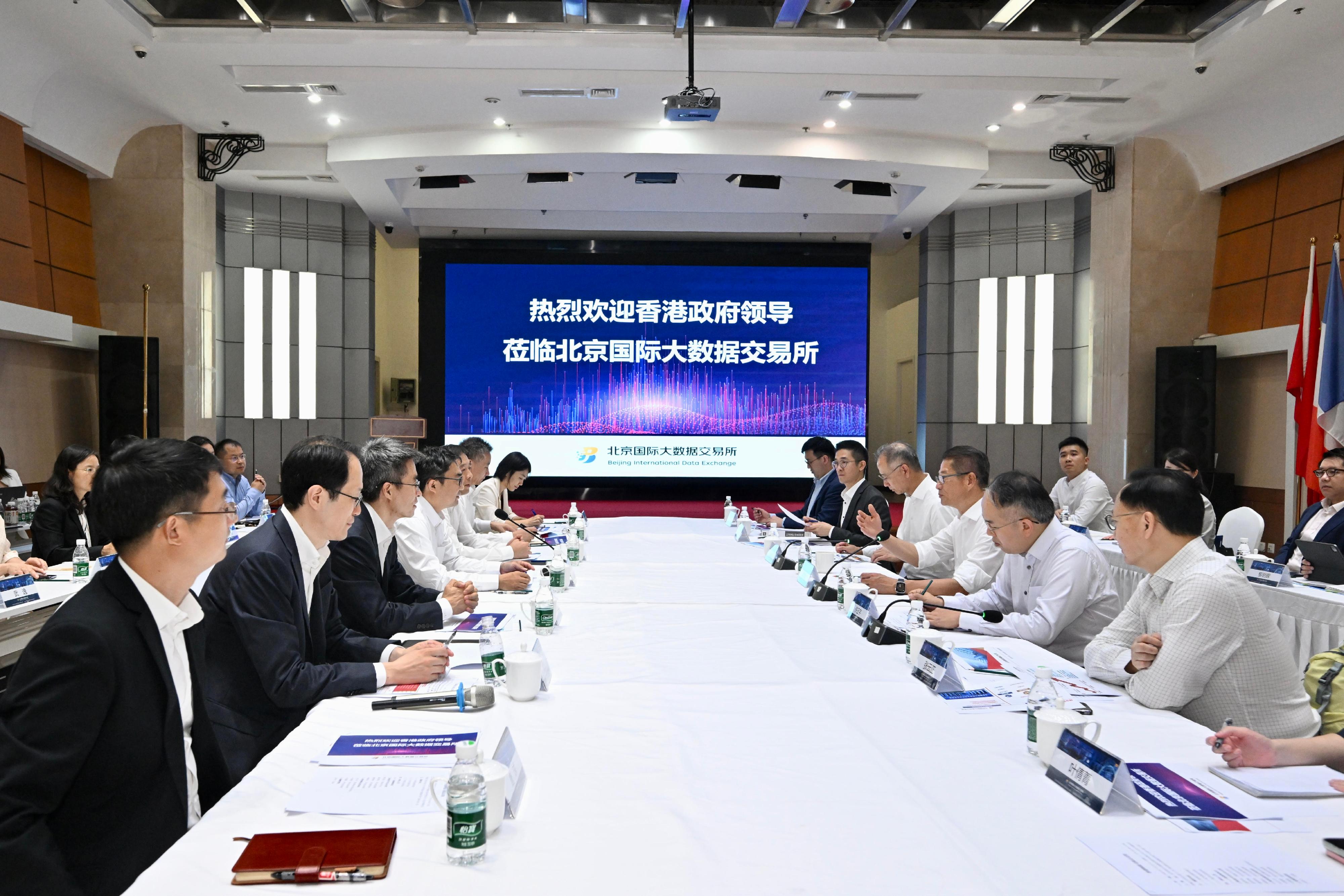 The Financial Secretary, Mr Paul Chan, began his visit programme to Beijing today (July 23). Photo shows Mr Chan (third right) visiting the Beijing International Data Exchange and meeting with the Chairman of the Beijing Financial Holdings Group, Mr Fan Wenzhong (fourth left), to gain a better understanding of its operations. The Secretary for Financial Services and the Treasury, Mr Christopher Hui (second right); the Chief Executive of the Hong Kong Monetary Authority, Mr Eddie Yue (fourth right); and the Chief Executive Officer of the Insurance Authority, Mr Clement Cheung (first right), are also in attendance.