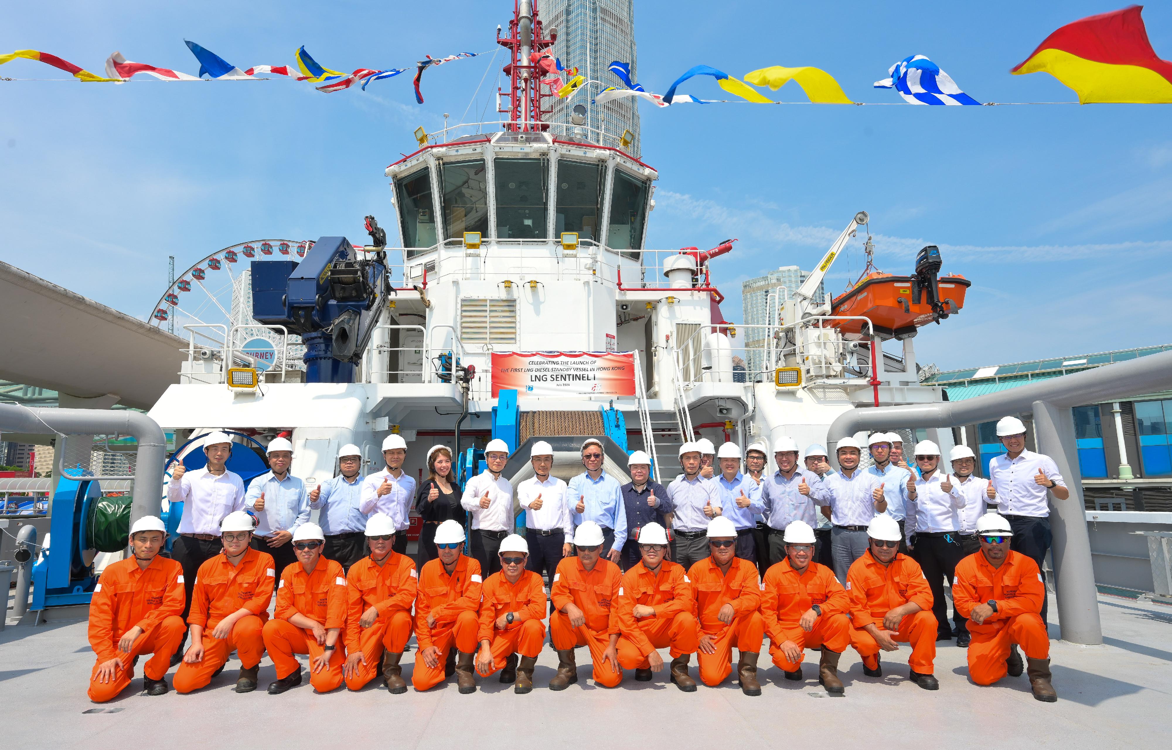 Marine Department representatives today (July 25) attended the ceremony held by the Hongkong Salvage & Towage Services Limited to celebrate the commissioning of the first two locally licensed LNG (liquefied natural gas) diesel dual-fuel tugs in Hong Kong. Photo shows Deputy Director of Marine Mr Shi Qiang (back row, seventh left); Assistant Director of Marine Mr Jerry Tang (back row, eighth left); the Chief Assistant Secretary of the Transport and Logistics Bureau, Miss Carmen Chan (back row, ninth left); the Executive Director of Hutchison Port Holdings Limited, Mr Paul Fan (back row, sixth left); the Chief Executive Officer of the Hongkong Salvage & Towage Services Limited, Ms Angelina Lei (back row, fifth left), and other guests and crew members at the celebration ceremony.   