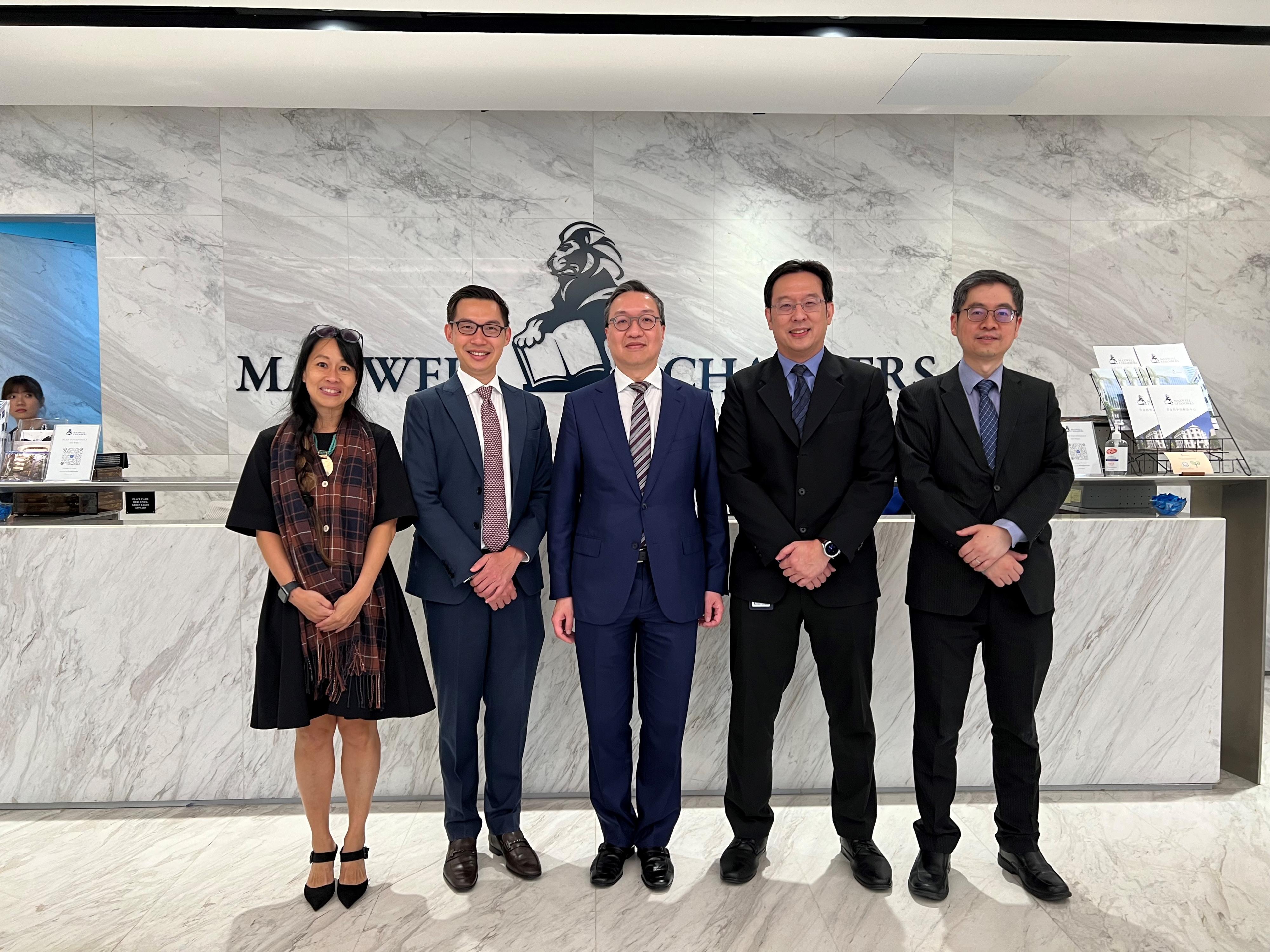 The Secretary for Justice, Mr Paul Lam, SC (centre), visited the Maxwell Chambers on July 24 in Singapore, and met with the Chairman of the Board of Directors of the Maxwell Chambers, Mr Daryl Chew (second left); the Chief Executive, Mr Ban Jiun Ean (second right); and the Chief Strategy Officer, Ms Karen Tan (first left), to exchange views on providing integrated facilities and services for the conduct of alternative dispute resolution activities. Also present was the Law Officer (International Law) of the Department of Justice, Dr James Ding (first right).
