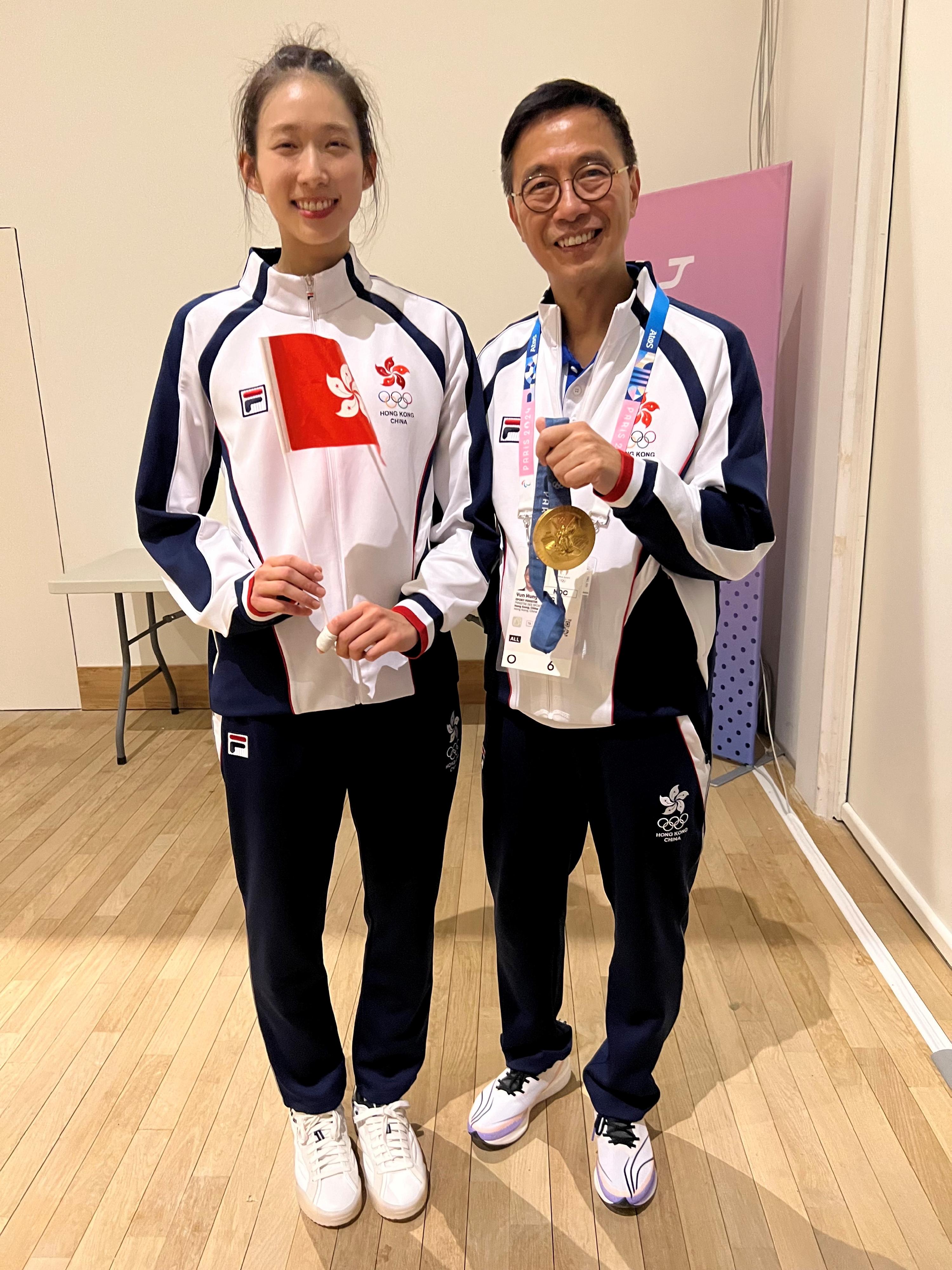 The Secretary for Culture, Sports and Tourism, Mr Kevin Yeung (right), extended his congratulations to Hong Kong fencing athlete Vivian Kong (left) on winning a gold medal in Women's Épée Individual event at the 2024 Paris Olympic Games on July 27 (Paris time).