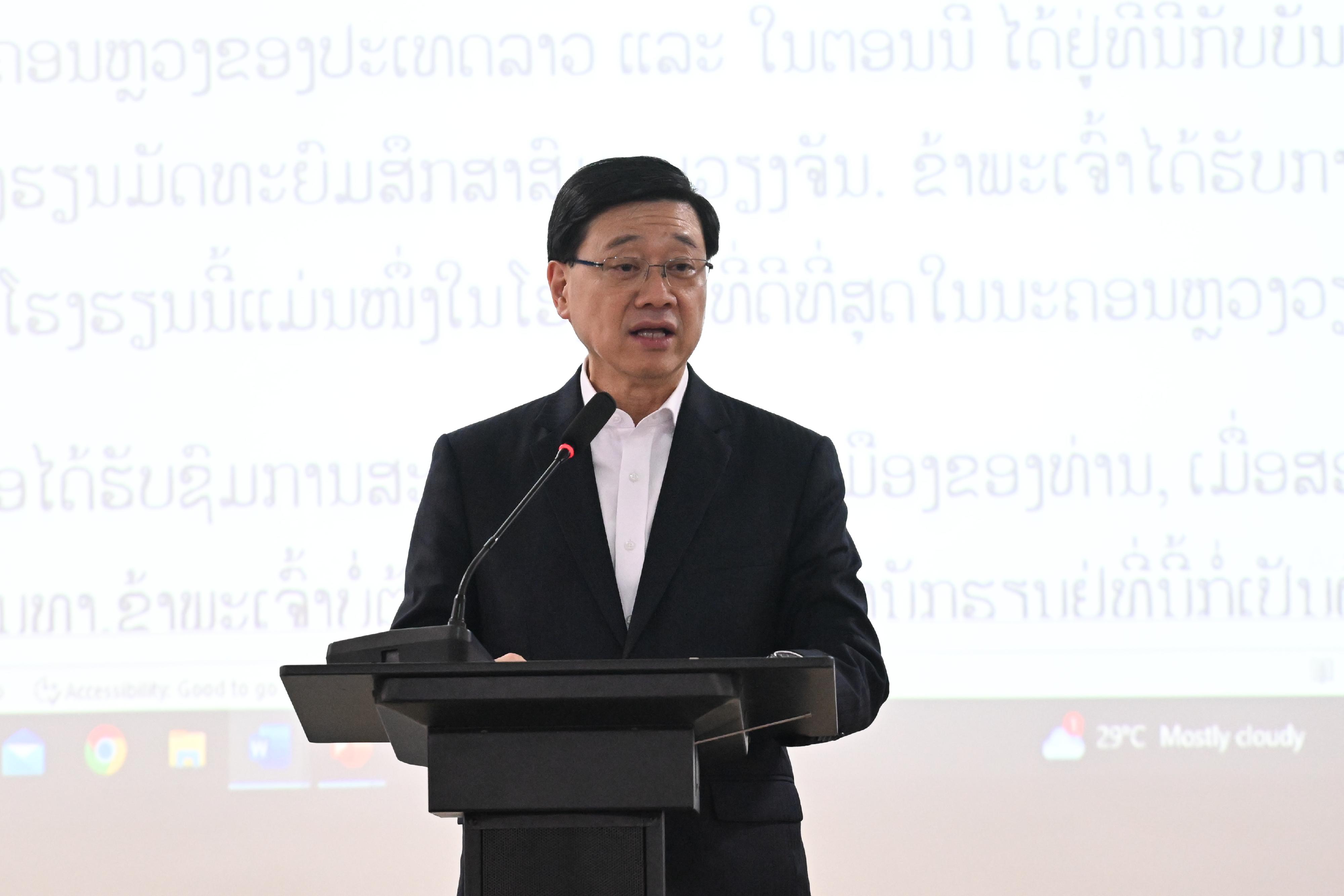 The Chief Executive, Mr John Lee, led a Hong Kong Special Administrative Region Government delegation to Laos and continued his visit programme today (July 29). Photo shows Mr Lee giving a speech at a secondary school at Laos.