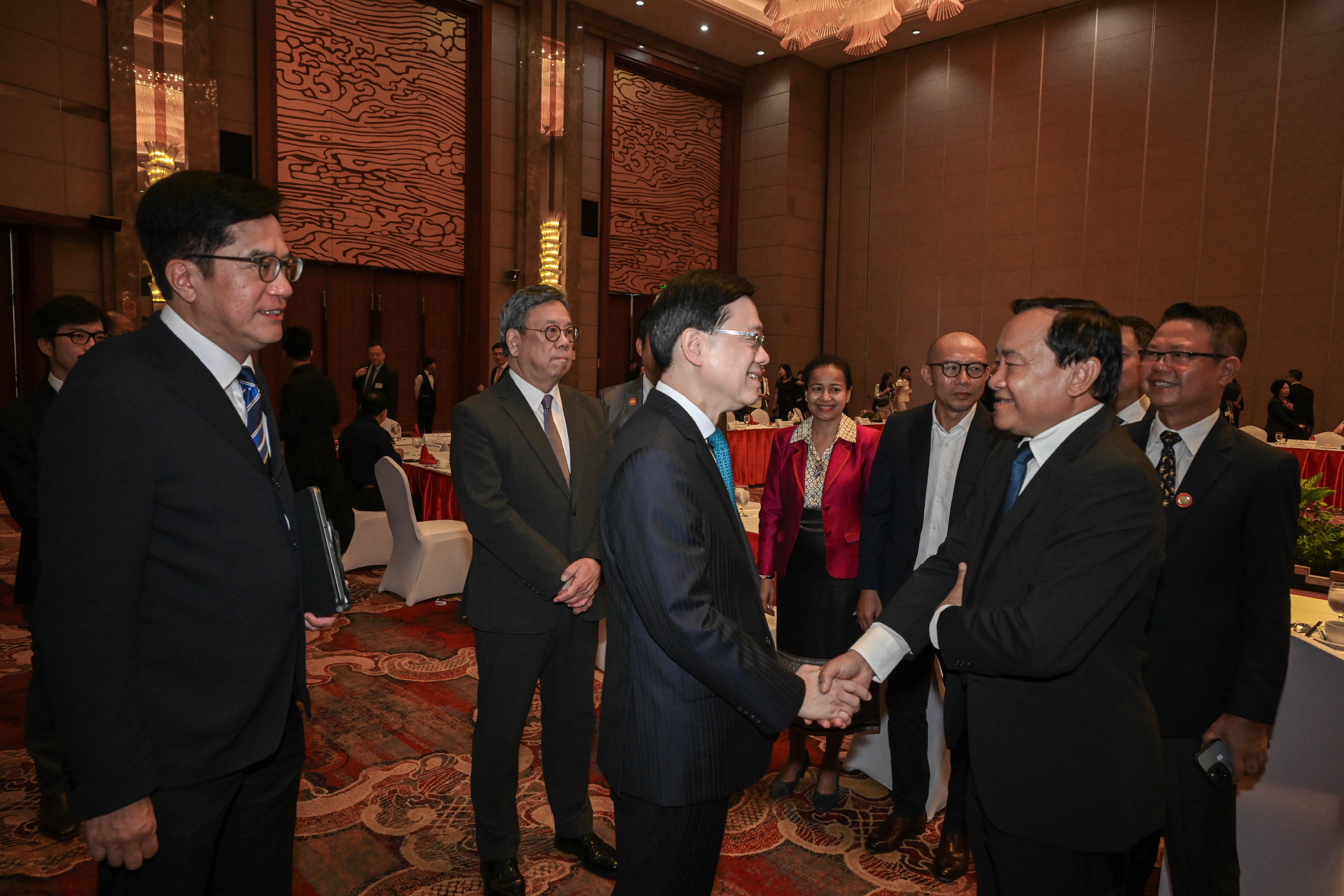 The Chief Executive, Mr John Lee, today (July 29) led a Hong Kong Special Administrative Region delegation to continue their visit in Vientiane, the capital of Laos. Photo shows Mr Lee (third left) meeting with key members of Lao National Chamber of Commerce and Industry. Also present were the Deputy Financial Secretary, Mr Michael Wong (first left), and the Secretary for Commerce and Economic Development, Mr Algernon Yau (second left).