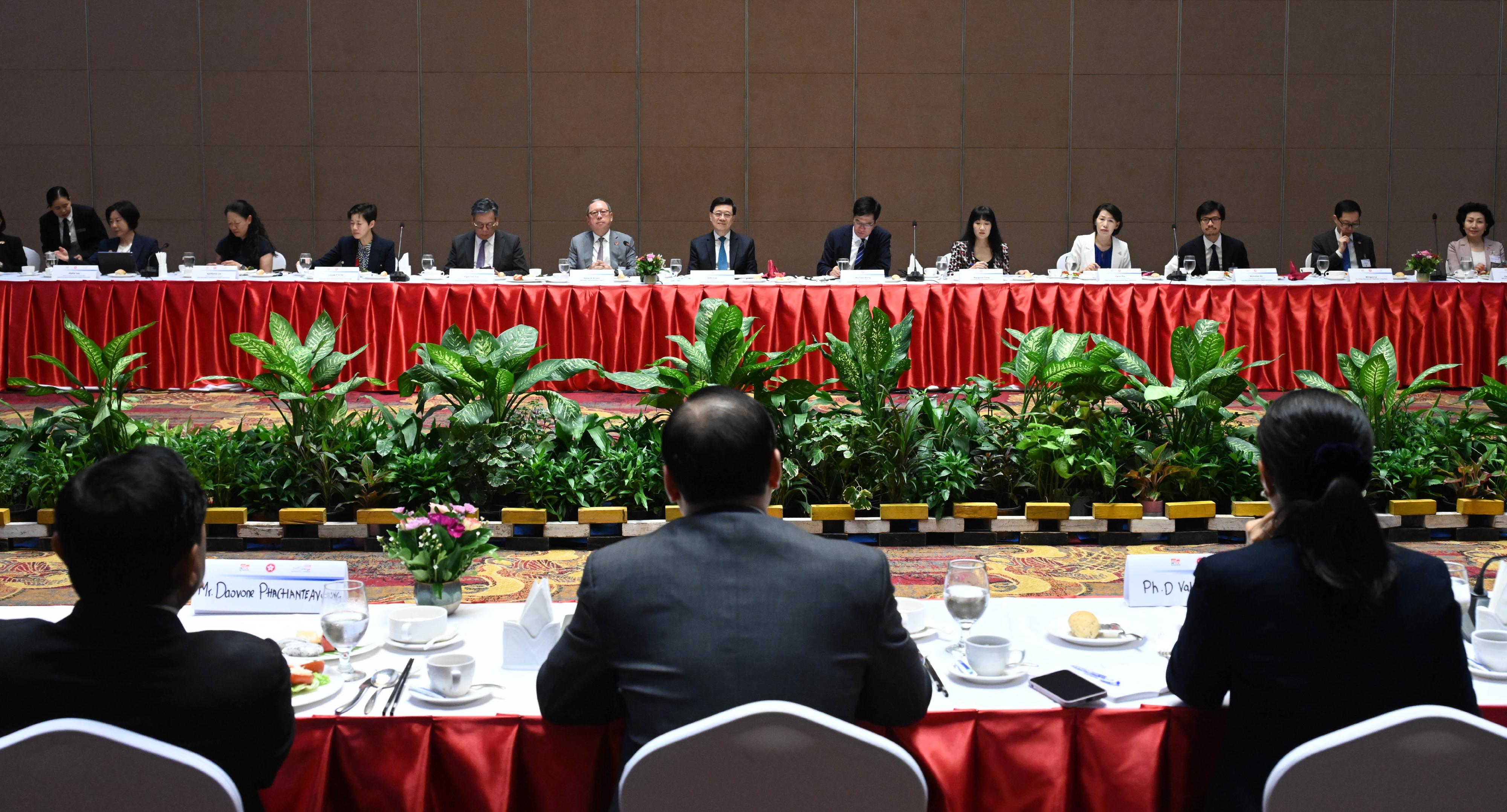 The Chief Executive, Mr John Lee, today (July 29) led a Hong Kong Special Administrative Region delegation to continue their visit in Vientiane, the capital of Laos. Photo shows Mr Lee (centre) and delegation members meeting with key members of Lao National Chamber of Commerce and Industry.