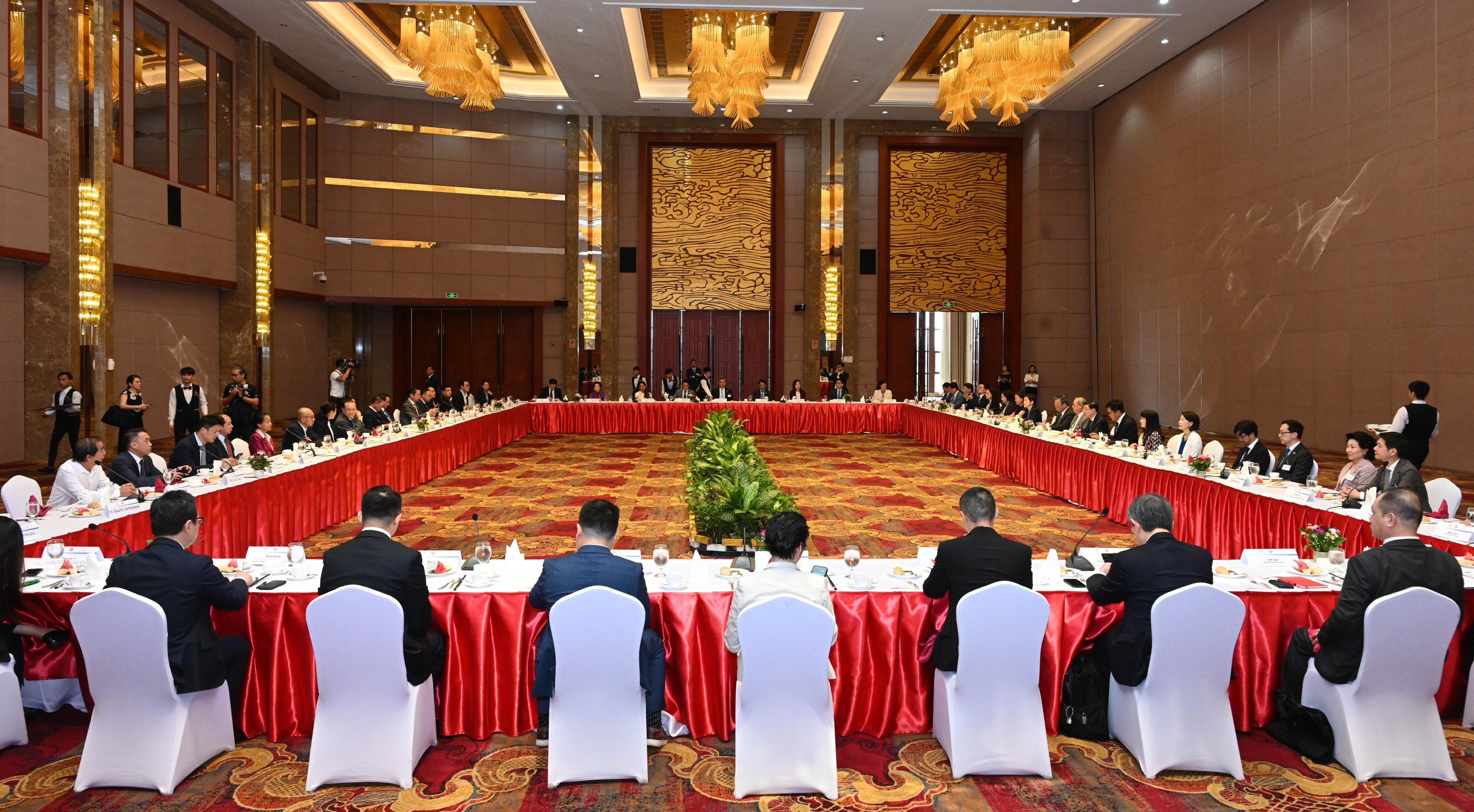 The Chief Executive, Mr John Lee, today (July 29) led a Hong Kong Special Administrative Region delegation to continue their visit in Vientiane, the capital of Laos. Photo shows Mr Lee and delegation members meeting with key members of Lao National Chamber of Commerce and Industry.