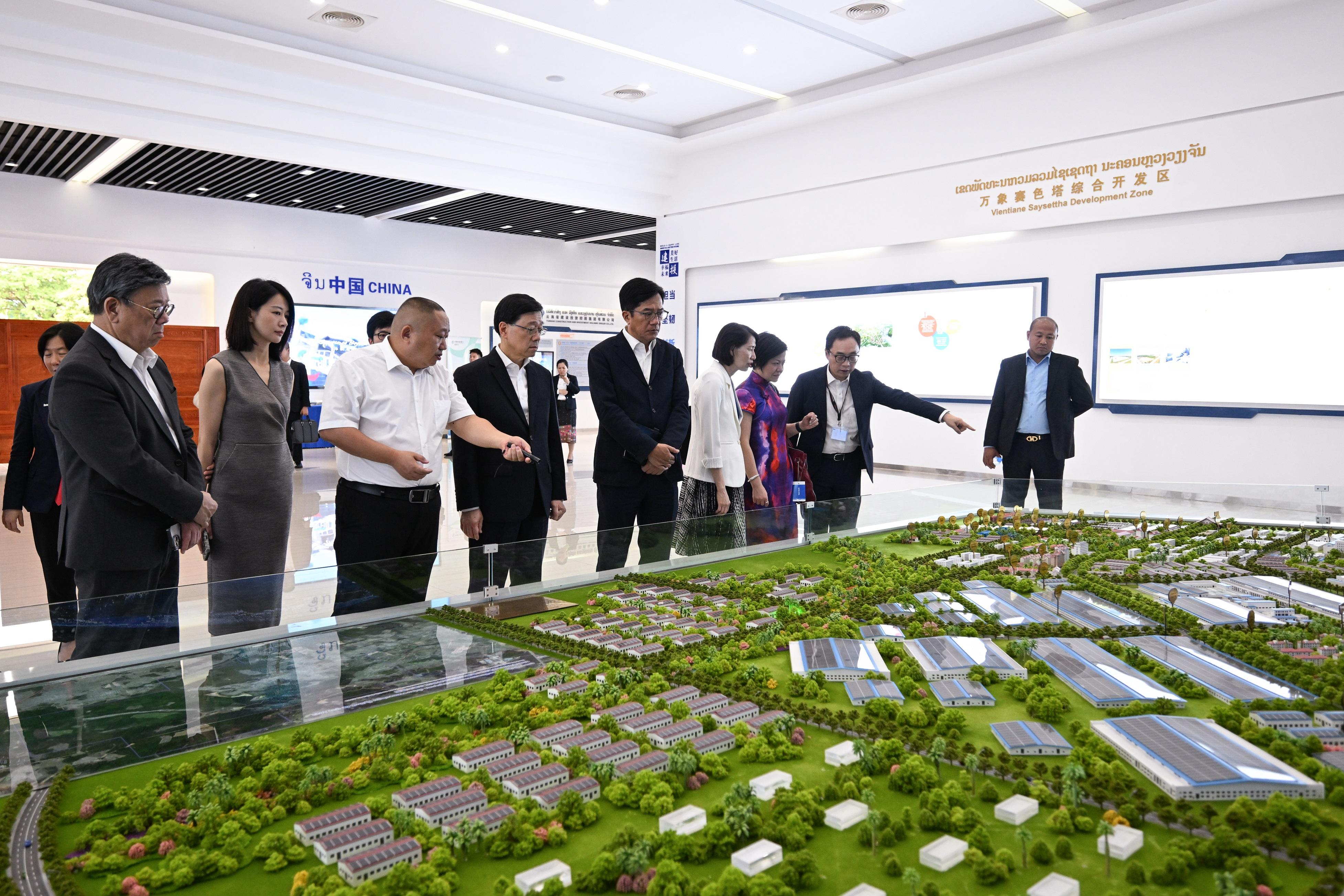 The Chief Executive, Mr John Lee, today (July 29) led a Hong Kong Special Administrative Region delegation to continue their visit in Vientiane, the capital of Laos. Photo shows Mr Lee (fourth left); the Deputy Financial Secretary, Mr Michael Wong (fifth left); and the Secretary for Commerce and Economic Development, Mr Algernon Yau (first left), and the delegation members being briefed about the Vientiane Sayettha Development Zone.