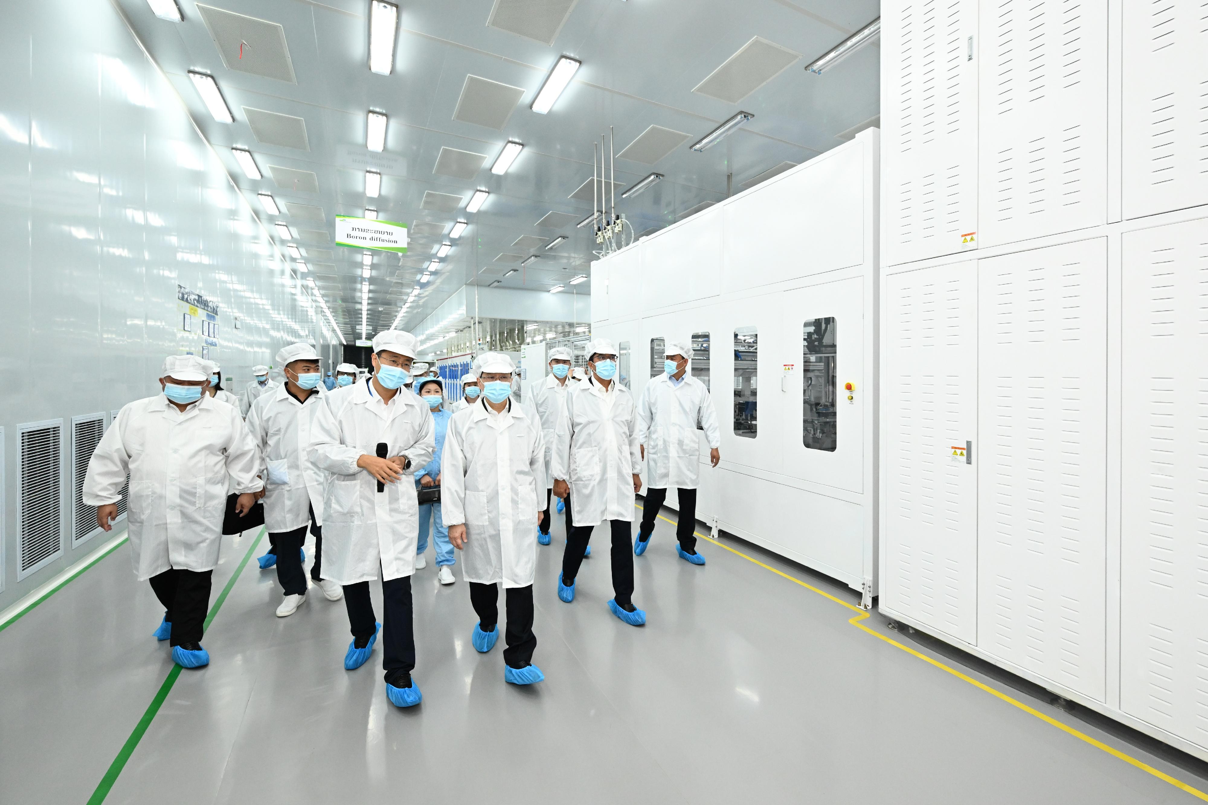 The Chief Executive, Mr John Lee, today (July 29) led a Hong Kong Special Administrative Region delegation to continue their visit in Vientiane, the capital of Laos. Photo shows Mr Lee (fourth right) visiting the SolarSpace Technology (Laos) Sole Co Ltd in the Vientiane Sayettha Development Zone to learn more about the business on solar cell panels and components production.