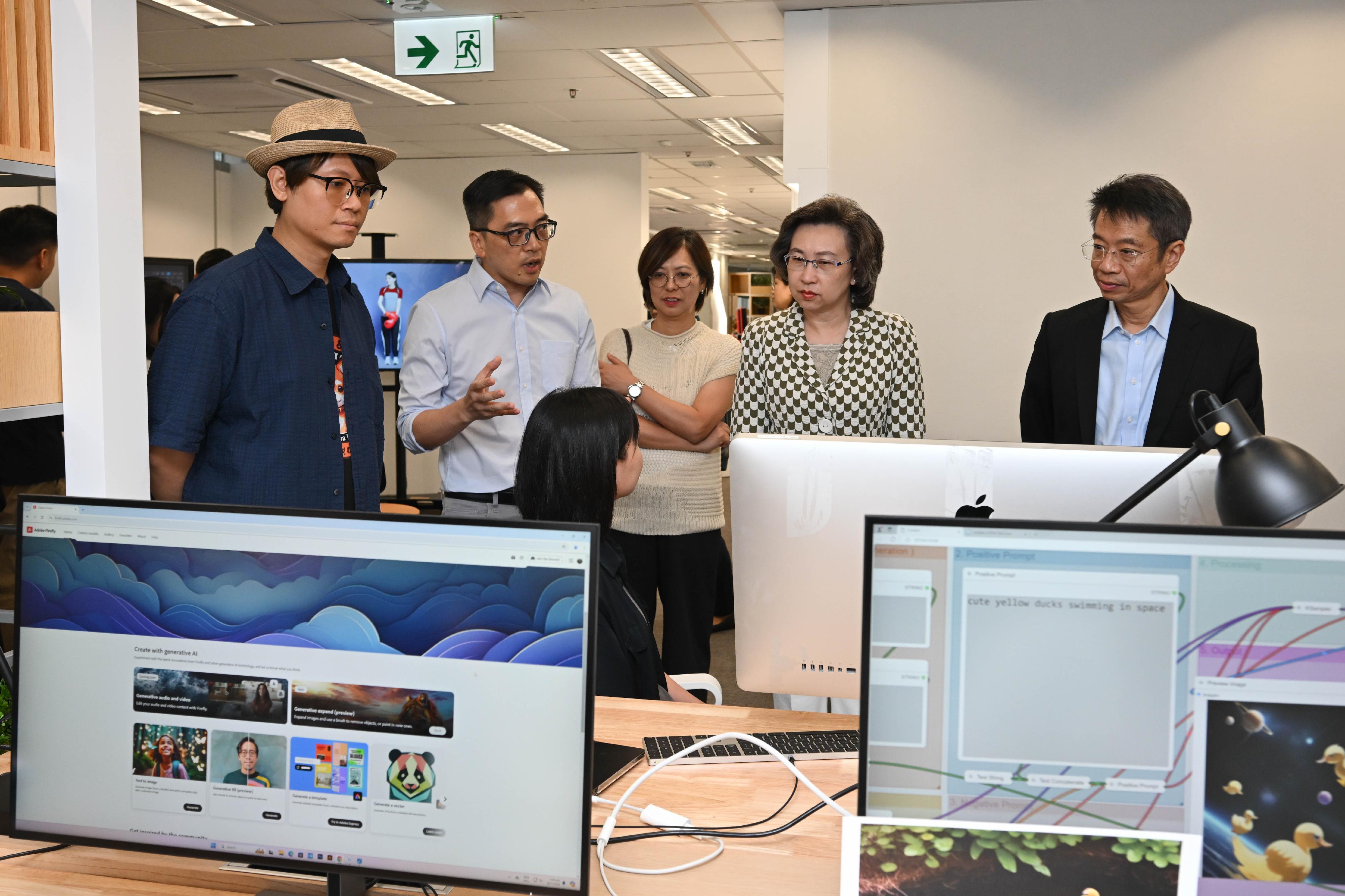 The Secretary for the Civil Service, Mrs Ingrid Yeung, today (July 30) visited the Artificial Intelligence Laboratory (AI Lab) and the new studios of Radio Television Hong Kong in Kwun Tong to see the department's new directions in the use of technology in television production. Photo shows production staff showing Mrs Yeung (second right) the use of artificial intelligence software in restoring old footage at the AI Lab. Looking on is the Permanent Secretary for the Civil Service, Mr Clement Leung (first right).