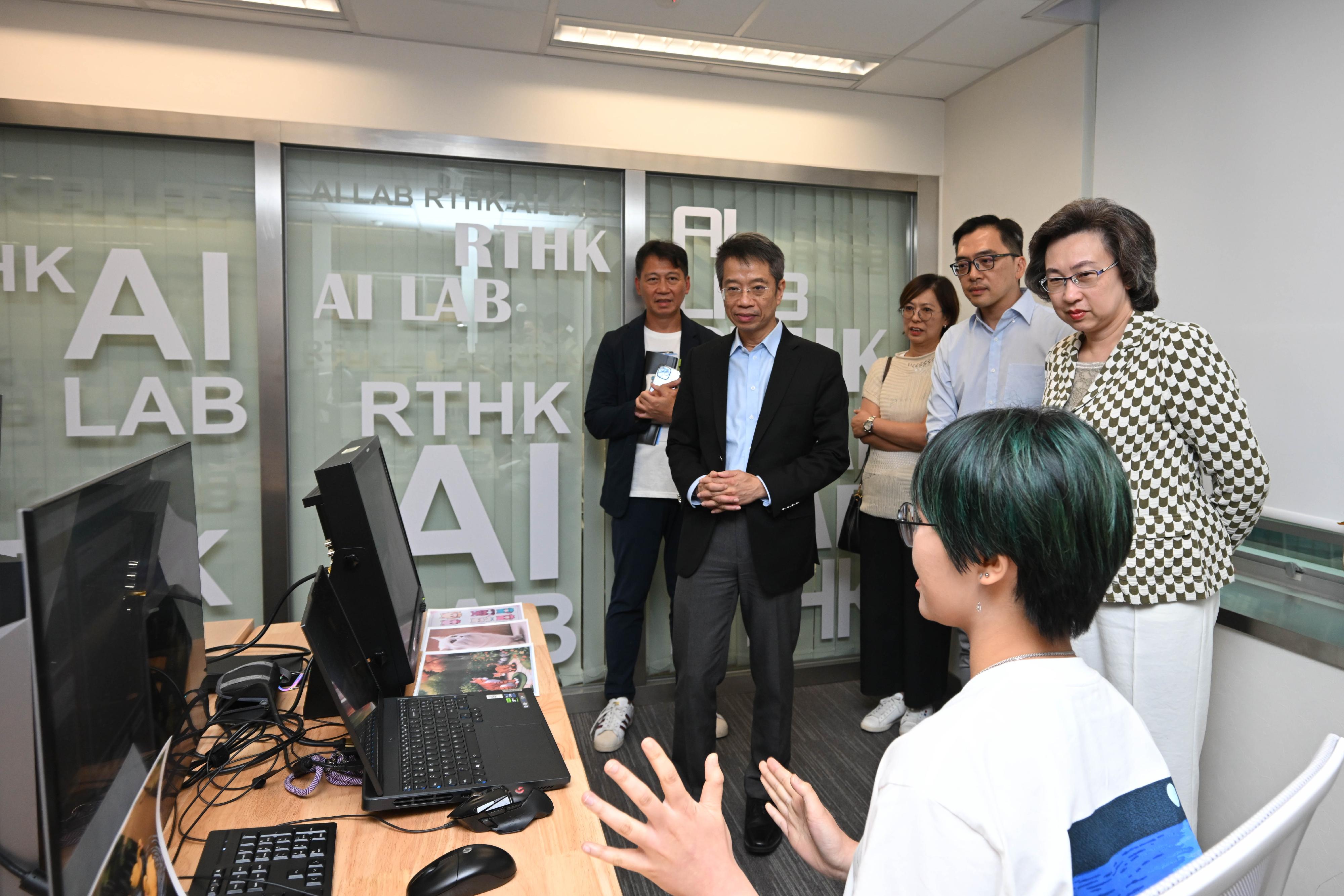 The Secretary for the Civil Service, Mrs Ingrid Yeung, today (July 30) visited the Artificial Intelligence Laboratory (AI Lab) and the new studios of Radio Television Hong Kong in Kwun Tong to see the department's new directions in the use of technology in television production. Photo shows production staff showing Mrs Yeung (first right) the use of artificial intelligence software in text-to-image or video generation at the AI Lab. Looking on are the Permanent Secretary for the Civil Service, Mr Clement Leung (second left), and the Director of Broadcasting, Mr Eddie Cheung (first left).