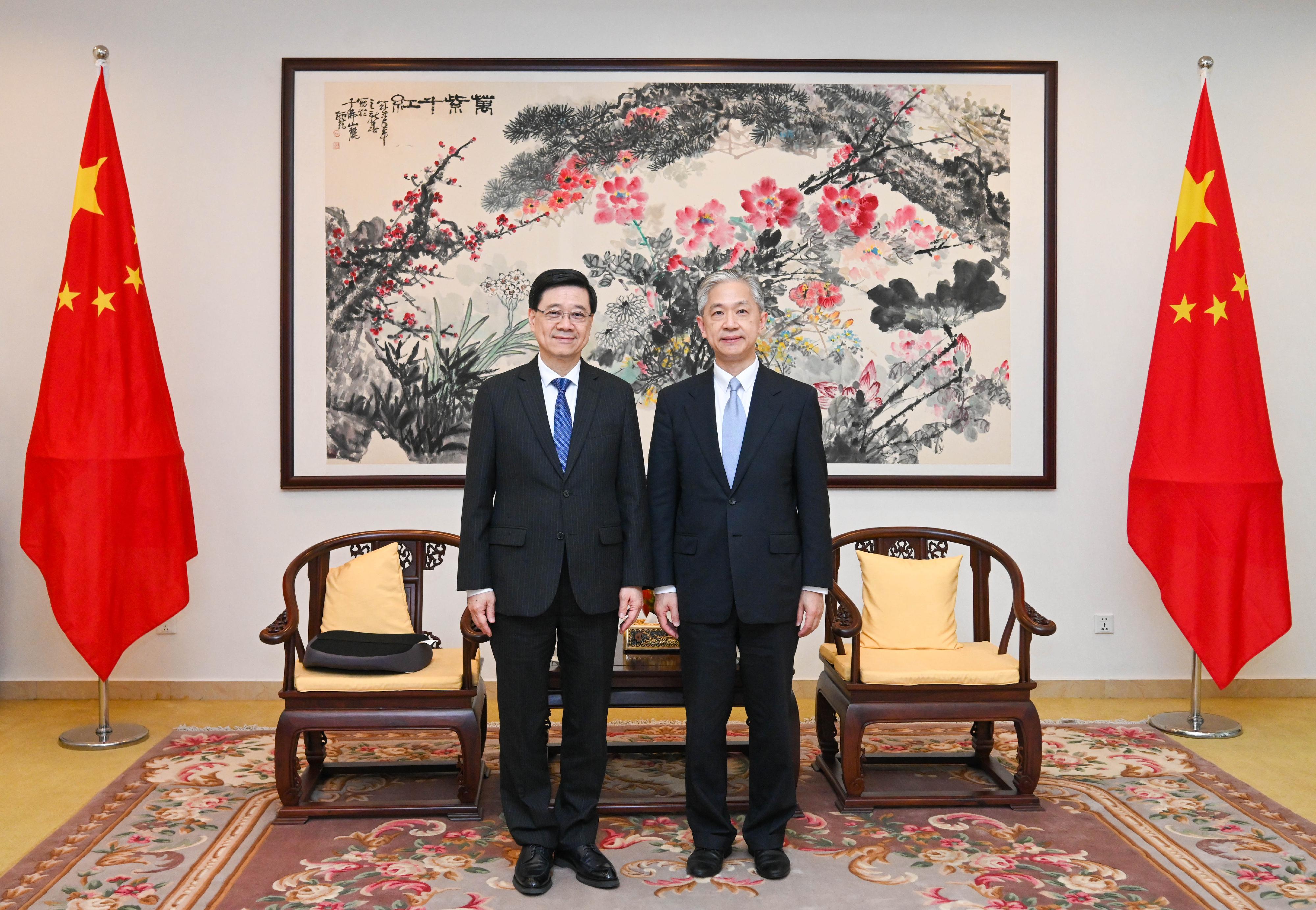 The Chief Executive, Mr John Lee (left), meets with the Ambassador Extraordinary and Plenipotentiary of the People's Republic of China to the Kingdom of Cambodia, Mr Wang Wenbin (right), in Cambodia today (July 30). 