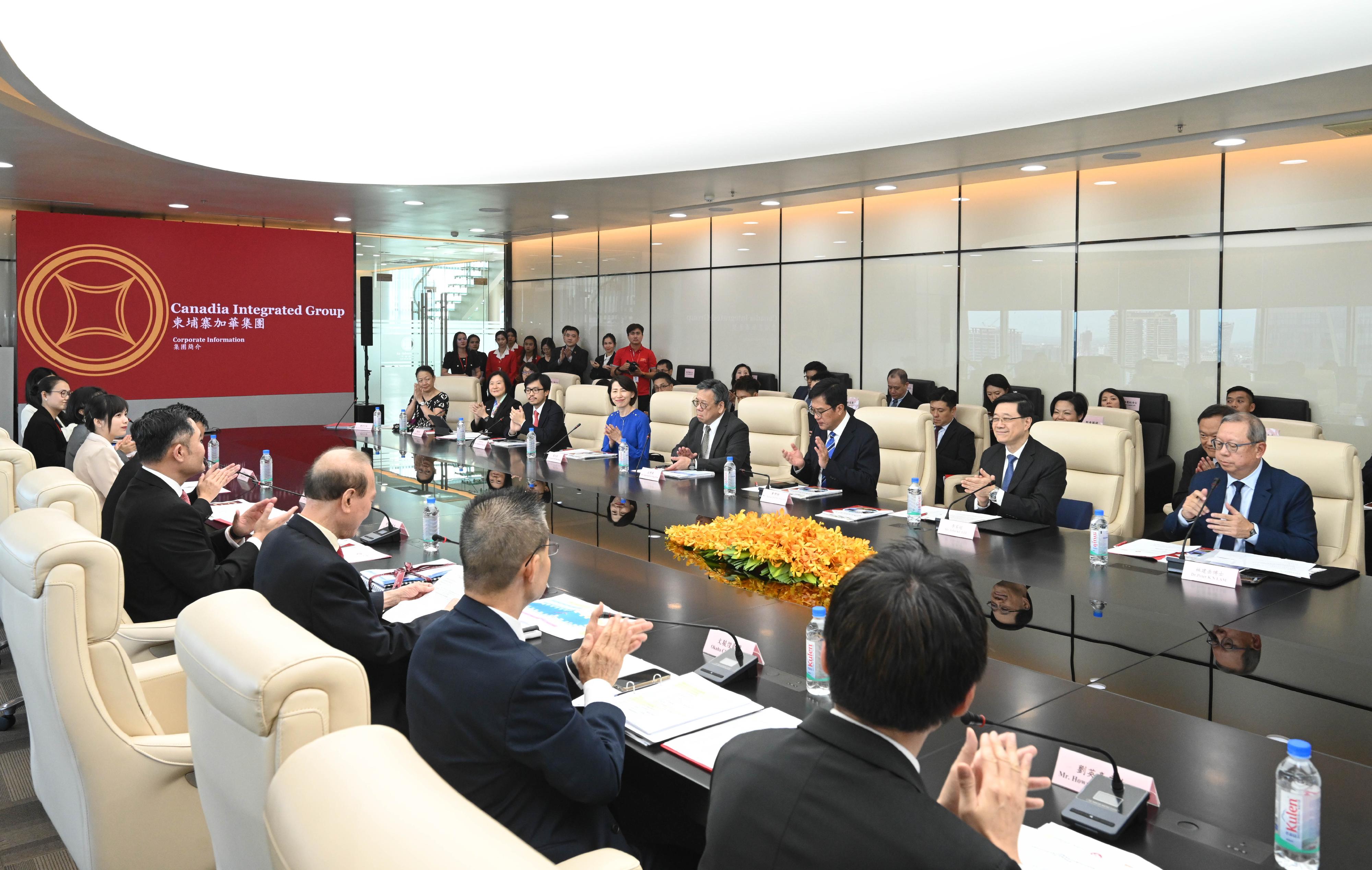 The Chief Executive, Mr John Lee, led a Hong Kong Special Administrative Region delegation to arrive in Cambodia to continue the visit in three member states of the Association of Southeast Asian Nations today (July 30). Photo shows Mr Lee (second right) visiting the Canadia Integrated Group.