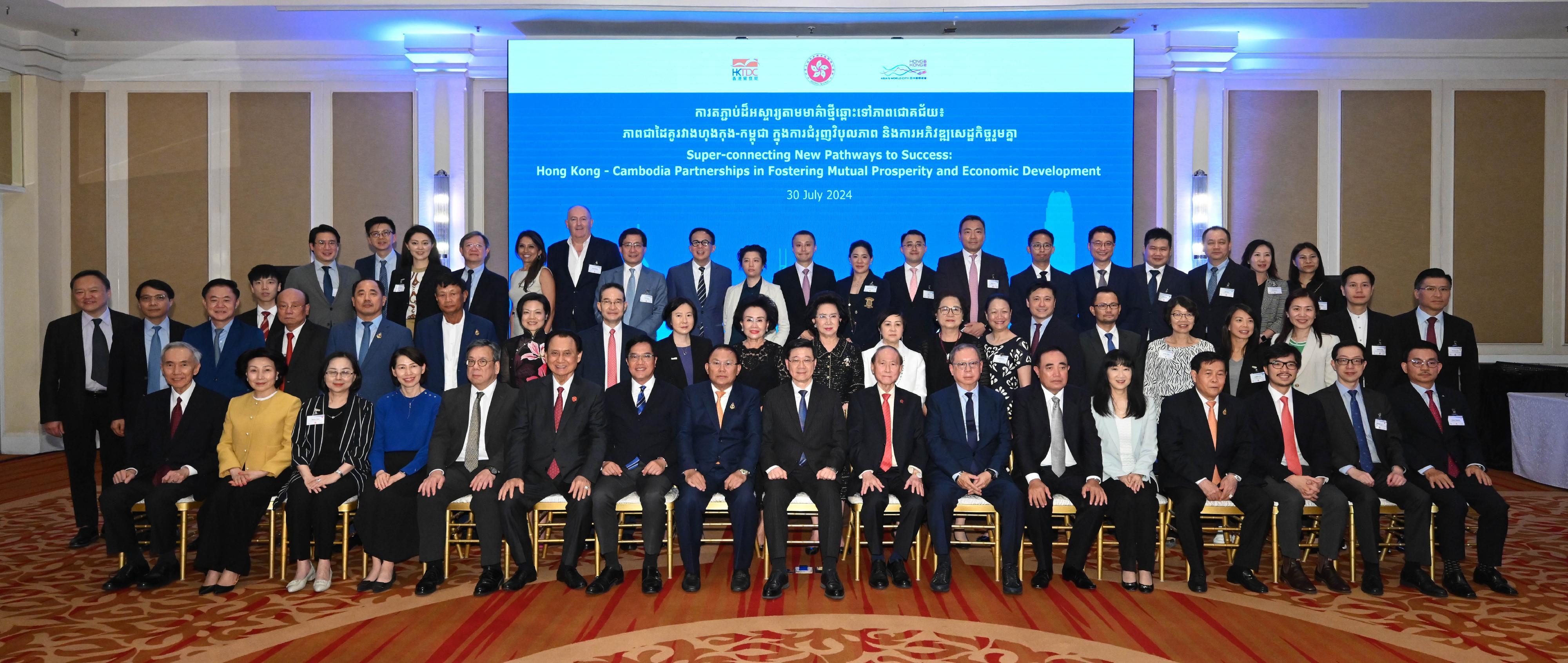 The Chief Executive, Mr John Lee, led a Hong Kong Special Administrative Region delegation to arrive in Cambodia to continue the visit in three member states of the Association of Southeast Asian Nations today (July 30). Photo shows Mr Lee (first row, centre); the Deputy Financial Secretary, Mr Michael Wong (first row, seventh left); the Secretary for Commerce and Economic Development, Mr Algernon Yau (first row, fifth left), and members of the delegation with key Cambodian business leaders at a dinner.