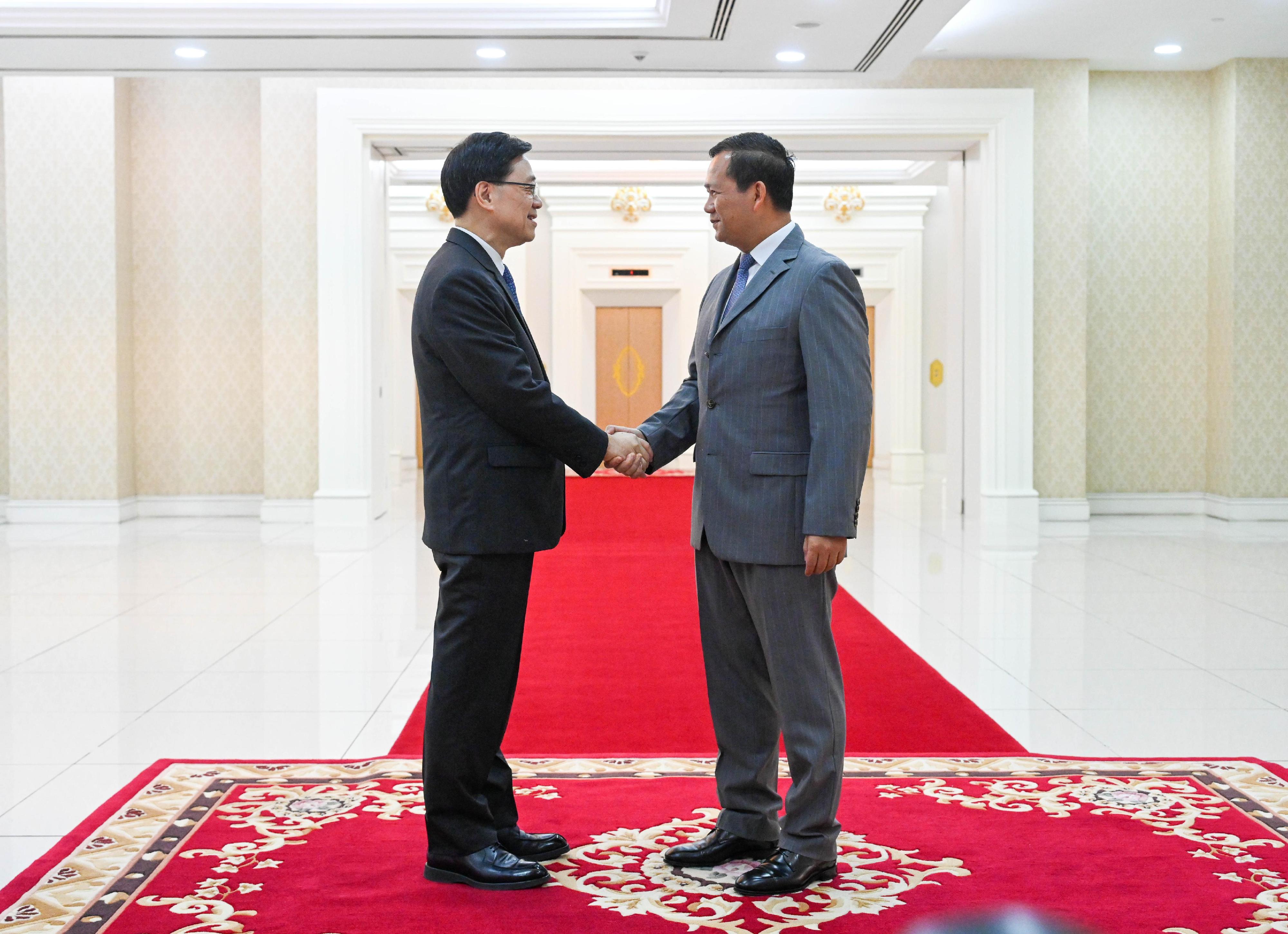 The Chief Executive, Mr John Lee (left), meets with the Prime Minister of Cambodia, Mr Hun Manet (right), in Cambodia today (July 31).