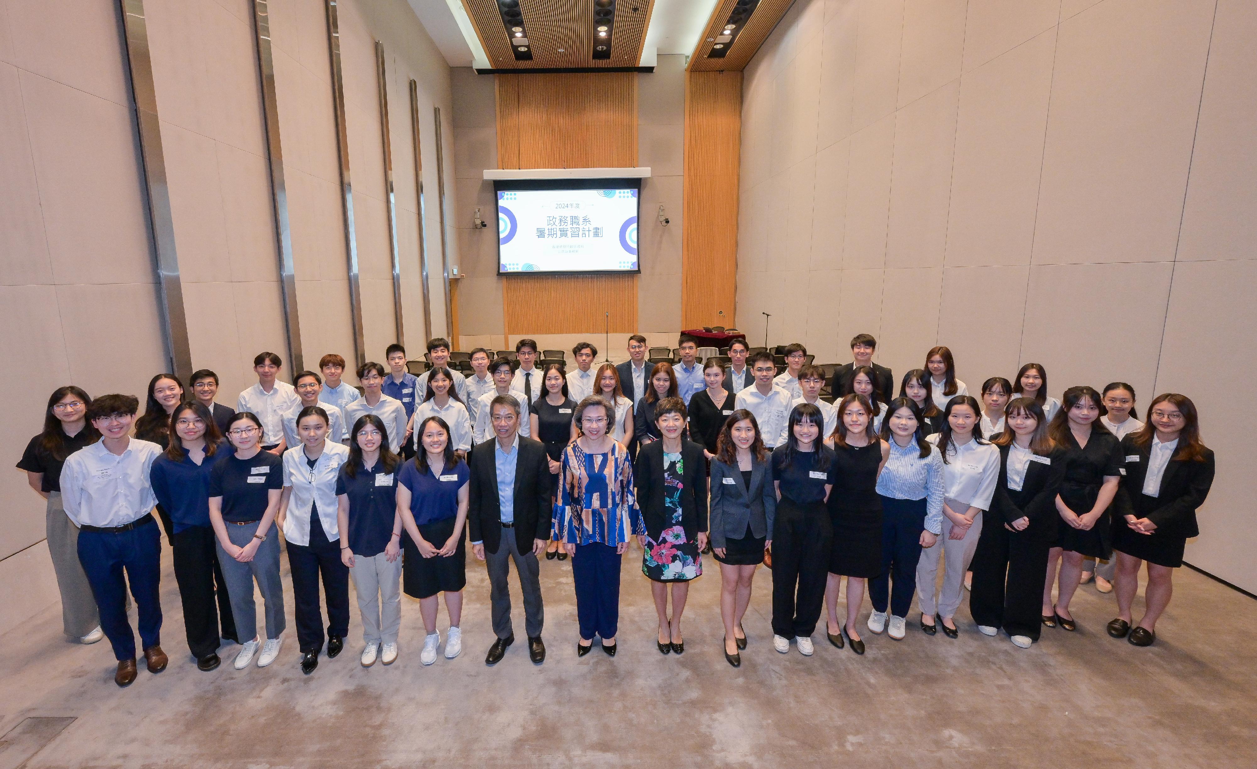 The Secretary for the Civil Service, Mrs Ingrid Yeung (first row, eighth left), today (August 1) met with over 40 university students participating in the Administrative Service Summer Internship Programme to hear their sharing on experiences gained from the internship, and encouraged them to apply for the Administrative Officer post. The Permanent Secretary for the Civil Service, Mr Clement Leung (first row, seventh left), and Deputy Secretary for the Civil Service Ms Eureka Cheung (first row, ninth left), also joined the sharing session with the interns and listened to their internship experiences. 