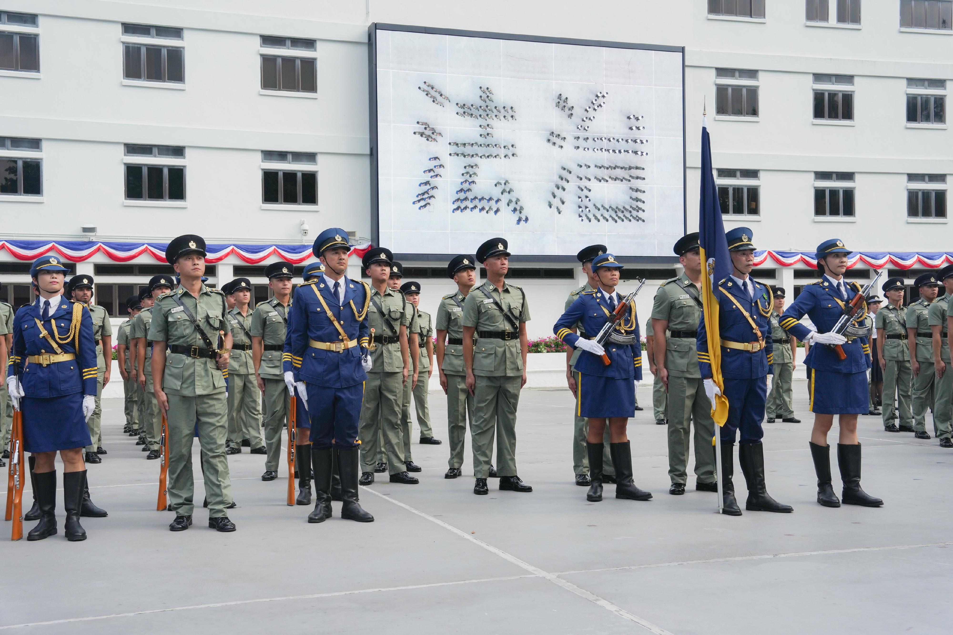 The Correctional Services Department held a passing-out parade at the Hong Kong Correctional Services Academy today (August 2). Photo shows passing-out correctional officers assembling to form the two Chinese characters of “the rule of law”, symbolising their devotion to Hong Kong and determination to uphold the rule of law.