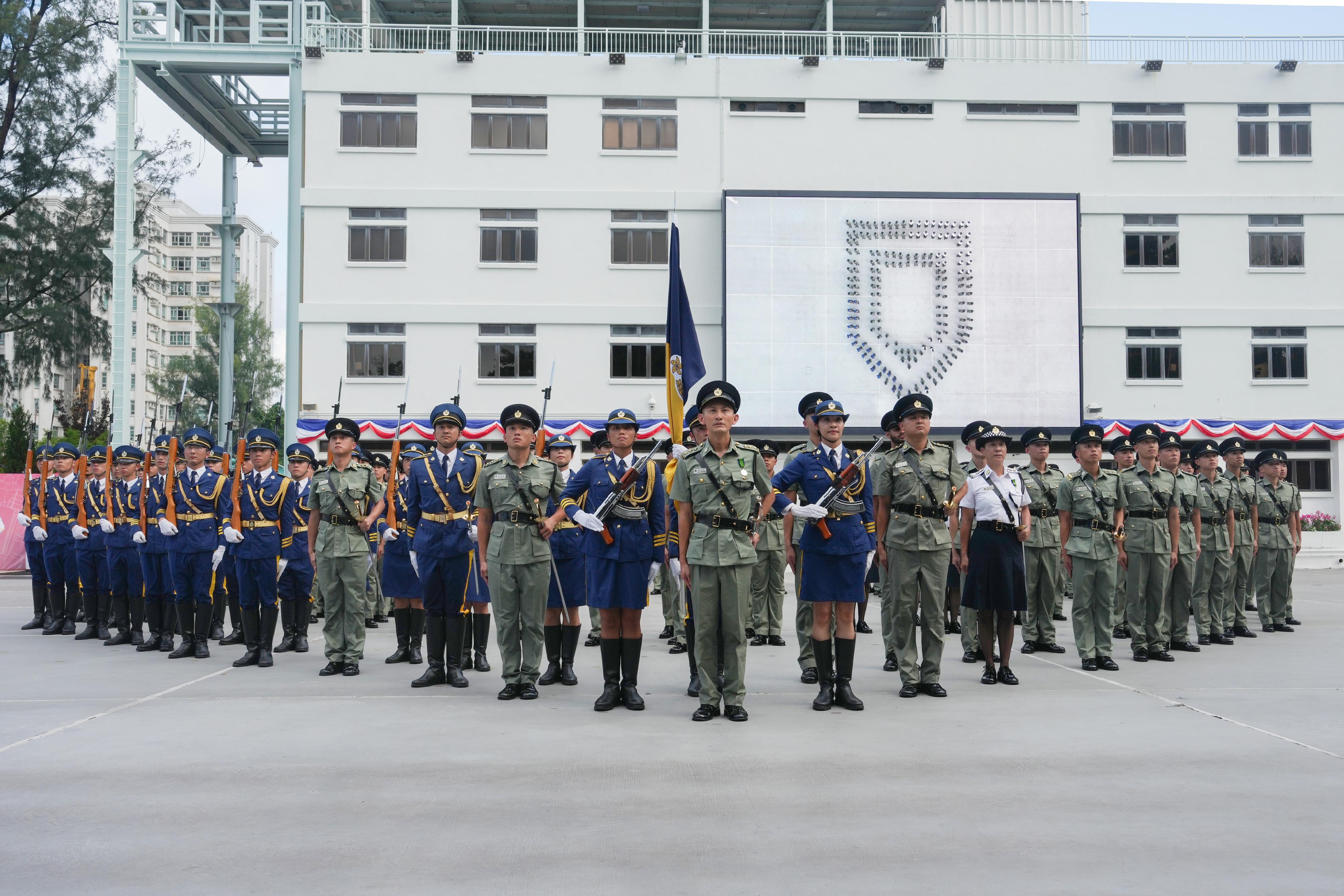 The Correctional Services Department held a passing-out parade at the Hong Kong Correctional Services Academy today (August 2). Photo shows passing-out correctional officers assembling to form a two-layer shield pattern, symbolising that the Hong Kong National Security Law and the Safeguarding National Security Ordinance will continue to uphold the principles of the rule of law, thereby safeguarding the country and Hong Kong.