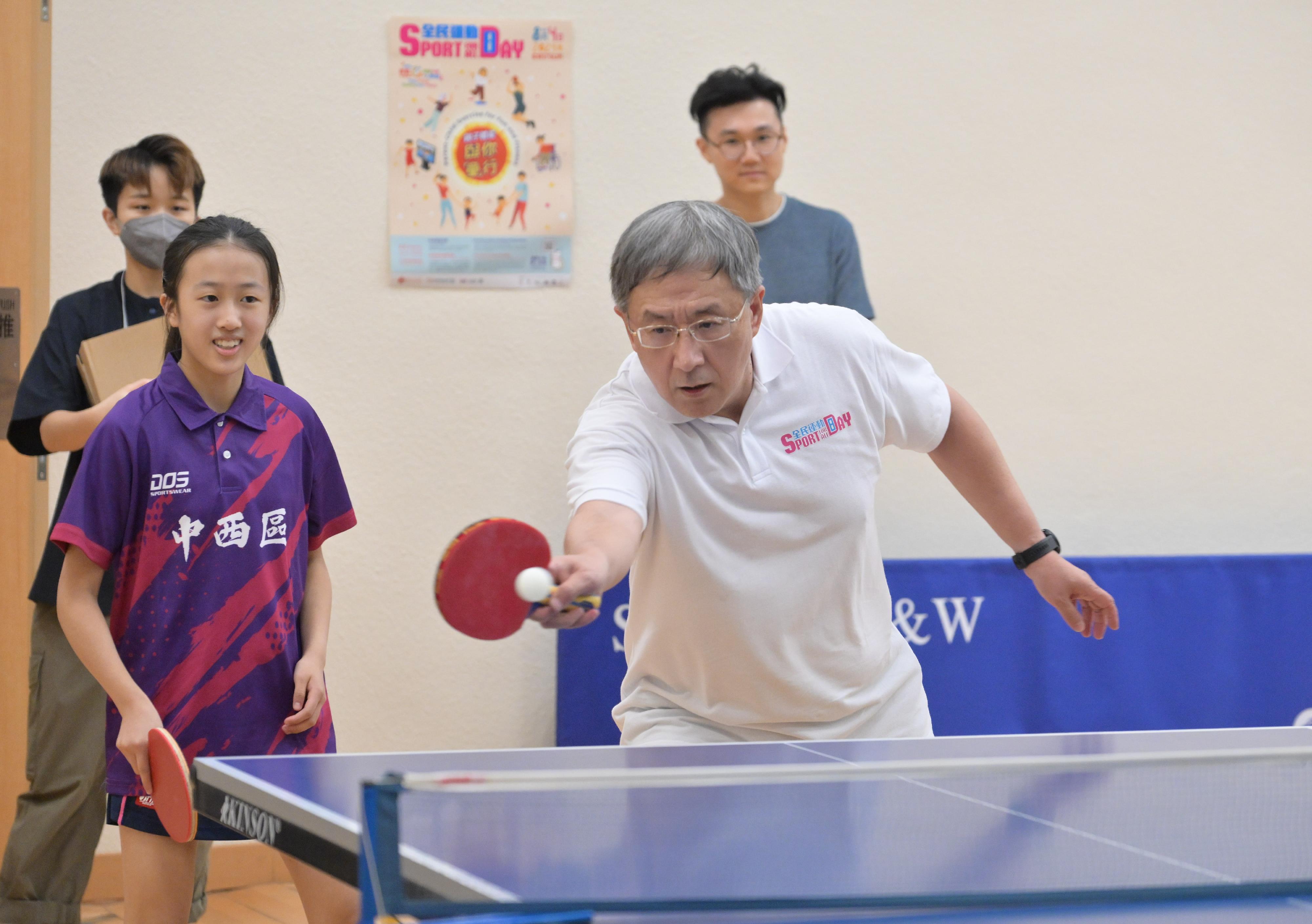 The Deputy Chief Secretary for Administration, Mr Cheuk Wing-hing (right), joins the public for table tennis participation activities at the Shek Tong Tsui Sports Centre today (August 4) as part of the Sport for All Day 2024 to drive home the message of staying active, healthy and happy.