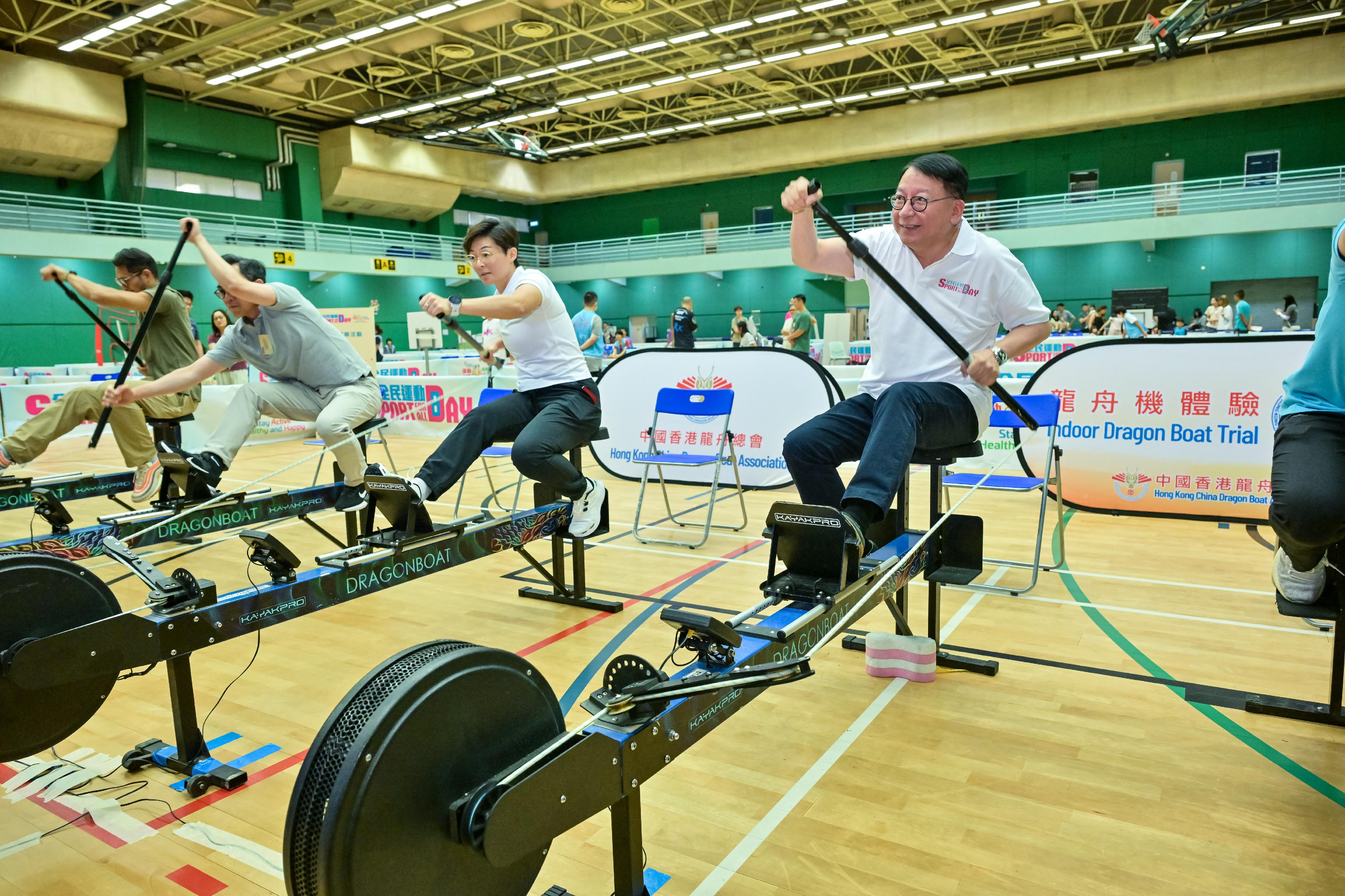 The Chief Secretary for Administration, Mr Chan Kwok-ki, attended the Sport For All Day 2024 held by the Leisure and Cultural Services Department this afternoon (August 4) at the Yuen Wo Road Sports Centre, Sha Tin, to promote the message of regular exercising for health. Photo shows Mr Chan (first right) and other guests dragon boating.