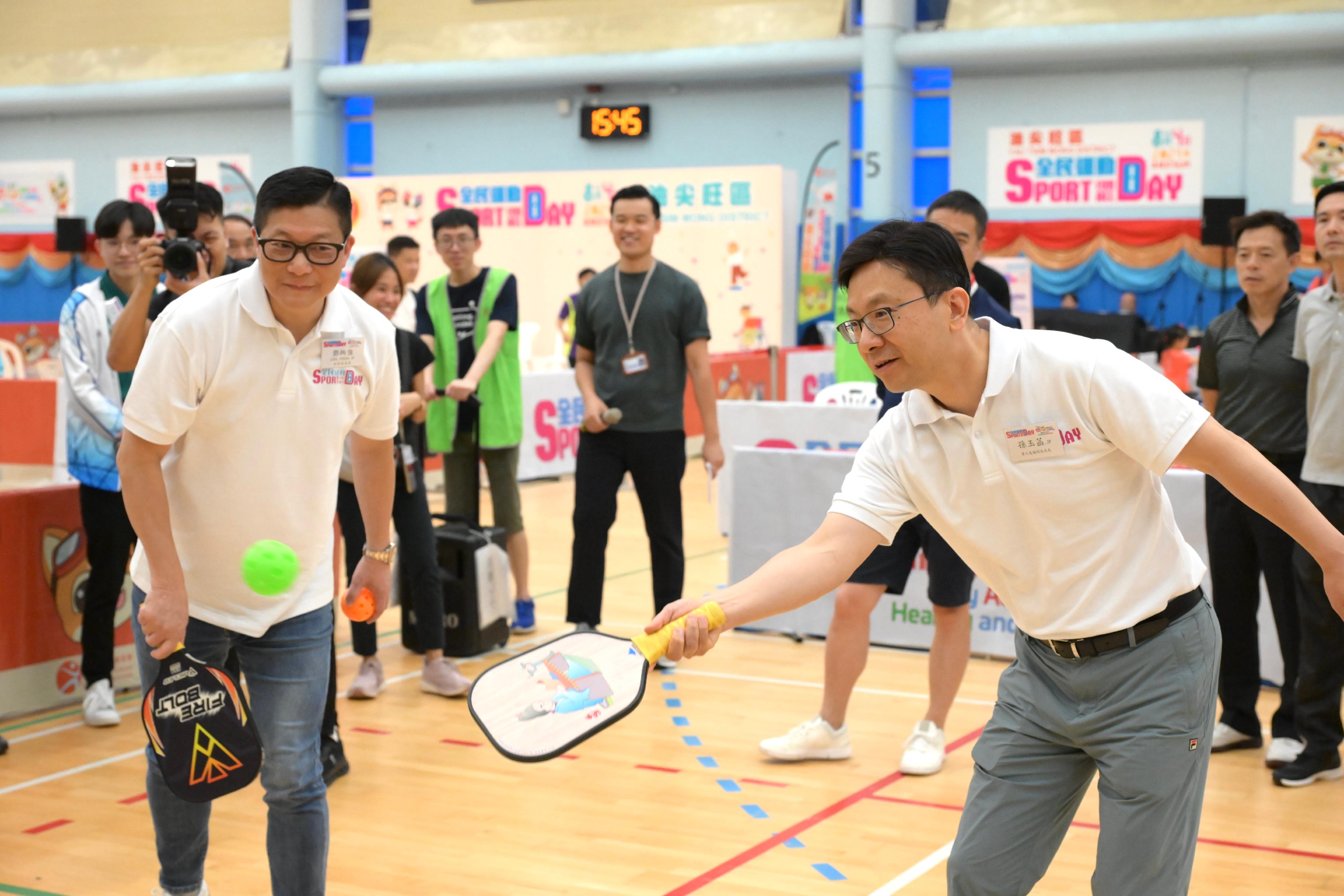 The Secretary for Security, Mr Tang Ping-keung, and the Secretary for Labour and Welfare, Mr Chris Sun, joined the public for sports and recreation programmes at Kowloon Park Sports Centre this afternoon (August 4) as part of the Sport For All Day 2024 organised by the Leisure and Cultural Services Department. Photo shows Mr Tang (left) and Mr Sun (right) in a Pickleball game.