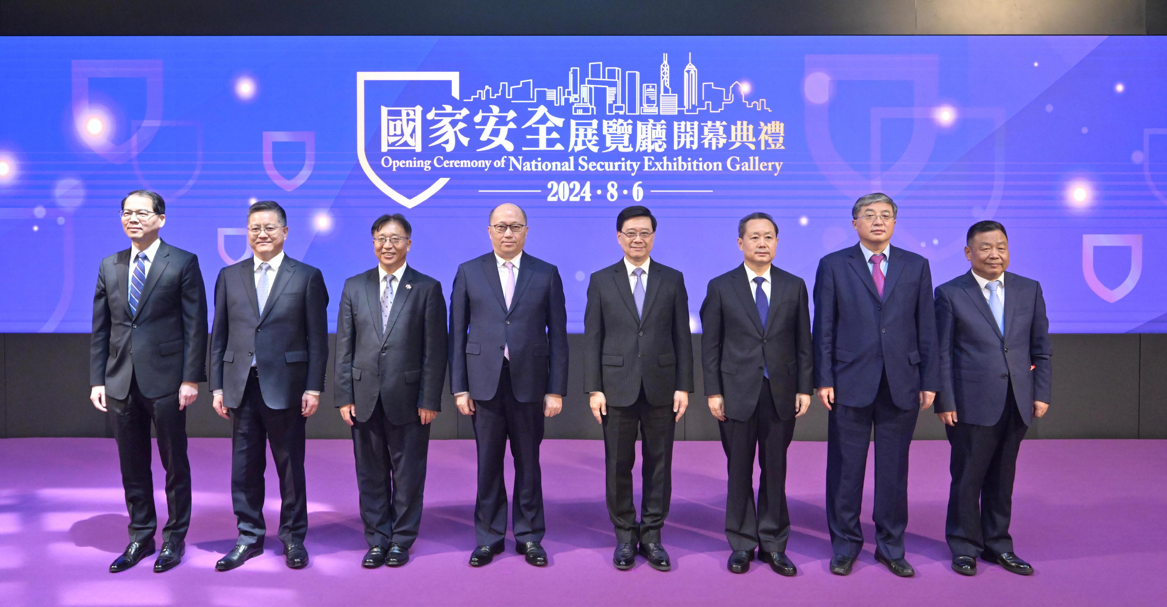 The Chief Executive, Mr John Lee, officiated at the Opening Ceremony of the National Security Exhibition Gallery today (August 6). Photo shows (from left) the Secretary General of the Committee for Safeguarding National Security of the Hong Kong Special Administrative Region (HKSAR), Mr Sonny Au; Deputy Head of the Office for Safeguarding National Security of the Central People's Government in the HKSAR Mr Li Jiangzhou; the Commissioner of the Ministry of Foreign Affairs in the HKSAR, Mr Cui Jianchun; the Director of the Liaison Office of the Central People's Government in HKSAR, Mr Zheng Yanxiong; Mr Lee; the Head of the Office for Safeguarding National Security of the Central People's Government in the HKSAR, Mr Dong Jingwei; Deputy Director of the Liaison Office of the Central People's Government in the HKSAR Mr Luo Yonggang; and the Chairman of the Bauhinia Culture Group, Mr Xu Zhengzhong, at the opening ceremony.