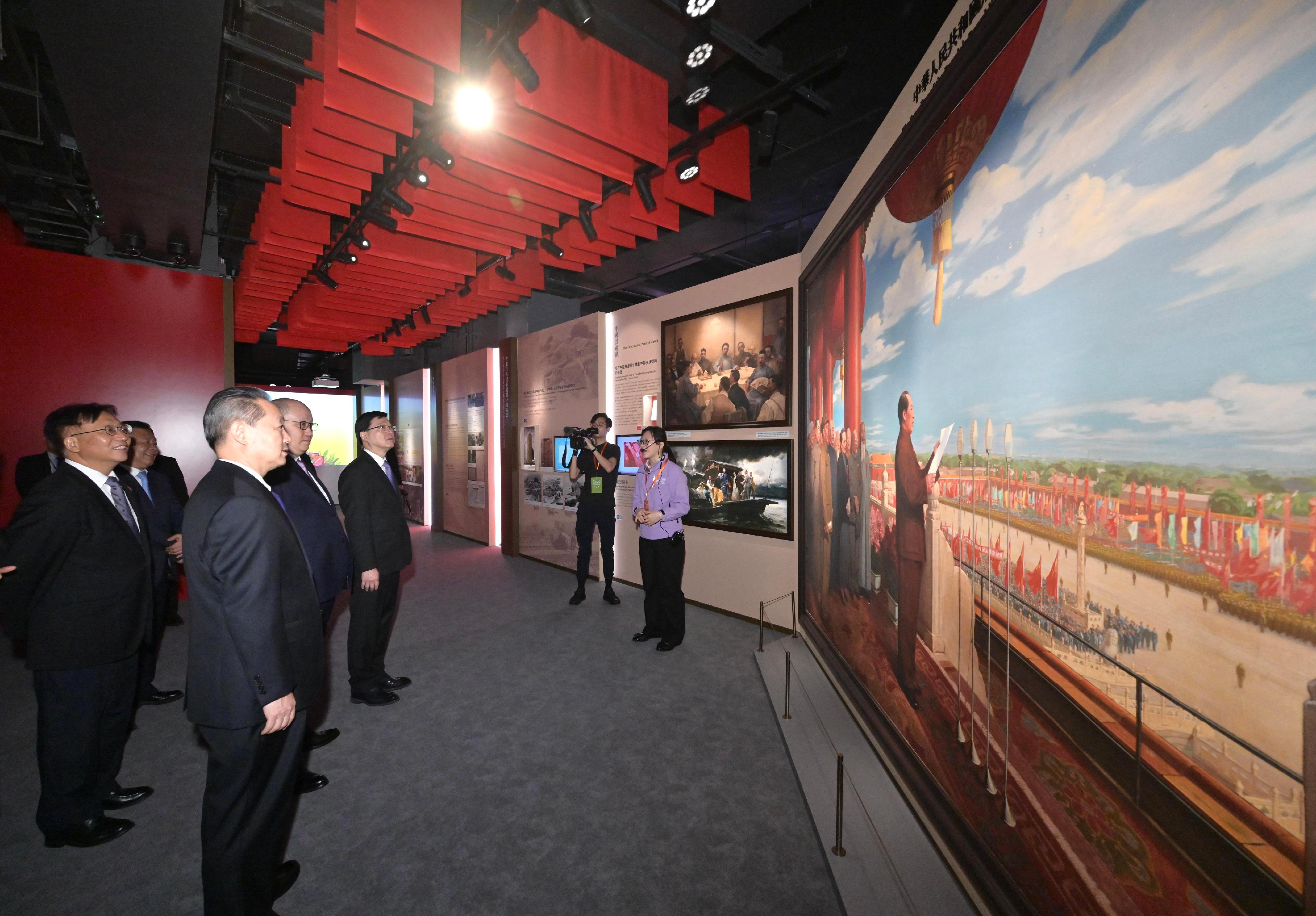 The Chief Executive, Mr John Lee, officiated at the Opening Ceremony of the National Security Exhibition Gallery today (August 6). Photo shows Mr Lee (fourth left) touring the exhibition. Looking on are the Commissioner of the Ministry of Foreign Affairs in the Hong Kong Special Administrative Region (HKSAR), Mr Cui Jianchun (first left); the Head of the Office for Safeguarding National Security of the Central People's Government in the HKSAR, Mr Dong Jingwei (second left); and the Director of the Liaison Office of the Central People's Government in the HKSAR, Mr Zheng Yanxiong (third left).