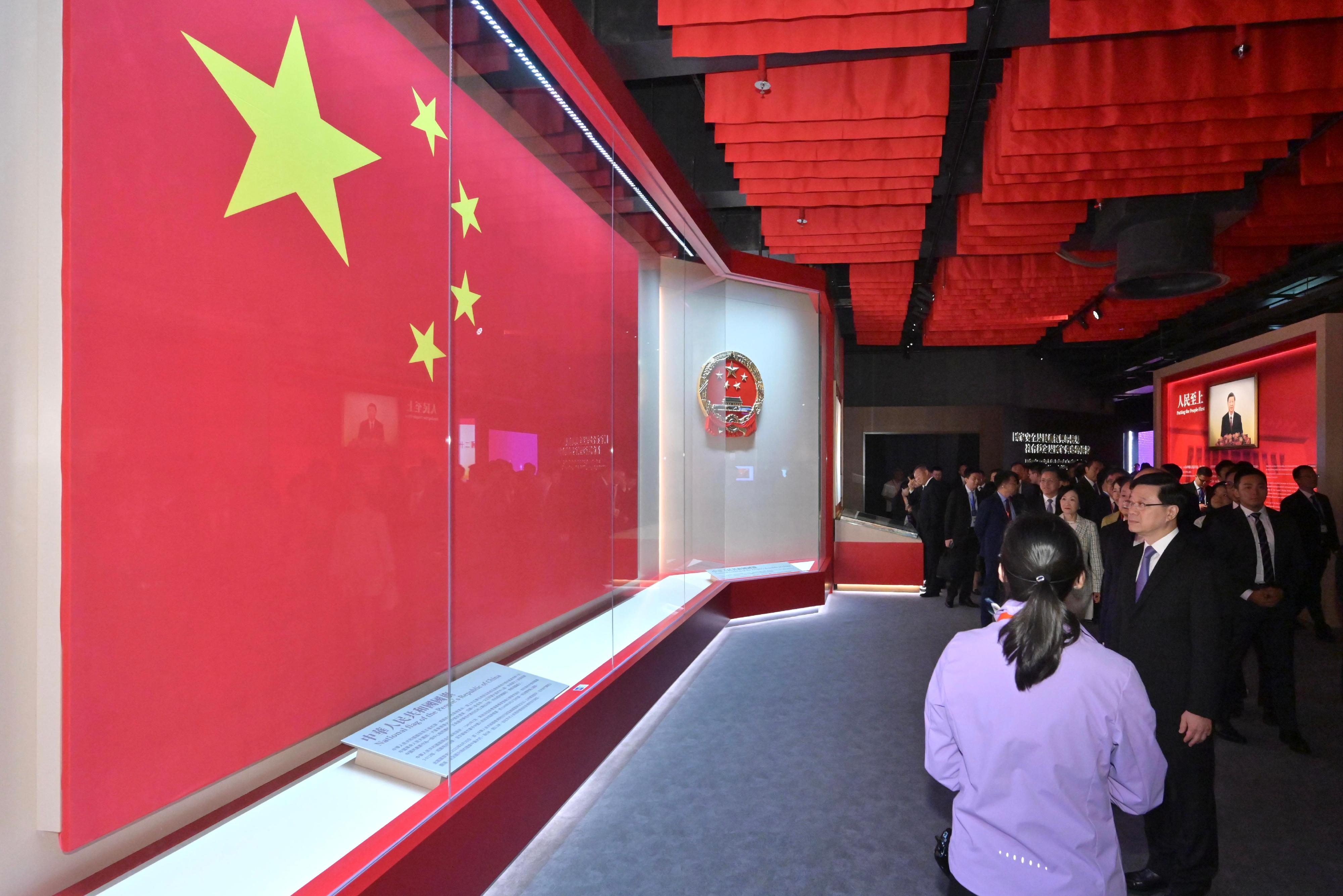 The Chief Executive, Mr John Lee, officiated at the Opening Ceremony of the National Security Exhibition Gallery today (August 6). Photo shows Mr Lee (front row, first right) touring the exhibition.