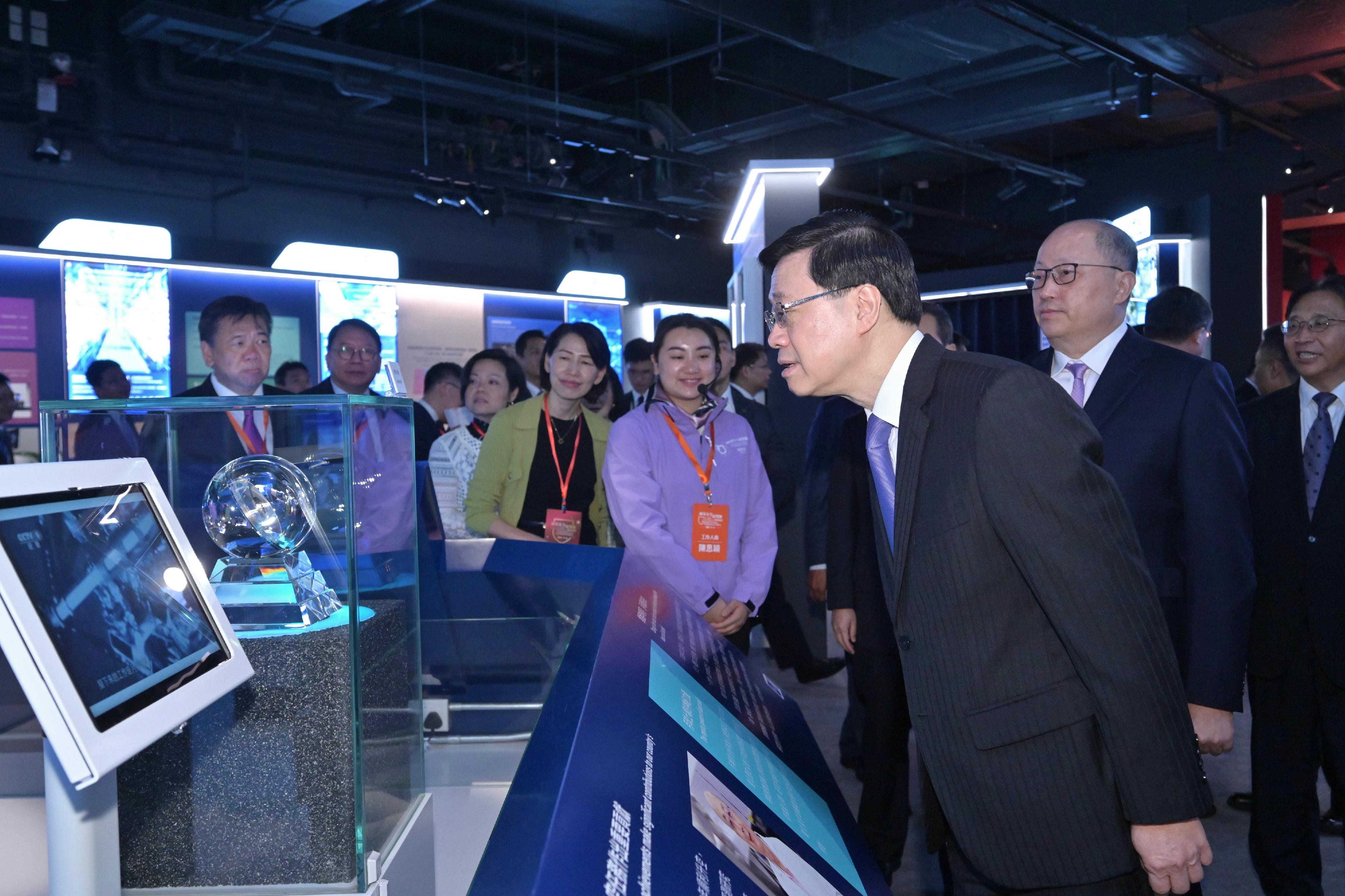 The Chief Executive, Mr John Lee, officiated at the Opening Ceremony of the National Security Exhibition Gallery today (August 6). Photo shows Mr Lee (third right) touring the exhibition. Looking on are the Director of the Liaison Office of the Central People's Government in the Hong Kong Special Administrative Region (HKSAR), Mr Zheng Yanxiong (second right); and the Commissioner of the Ministry of Foreign Affairs in the HKSAR, Mr Cui Jianchun (first right).