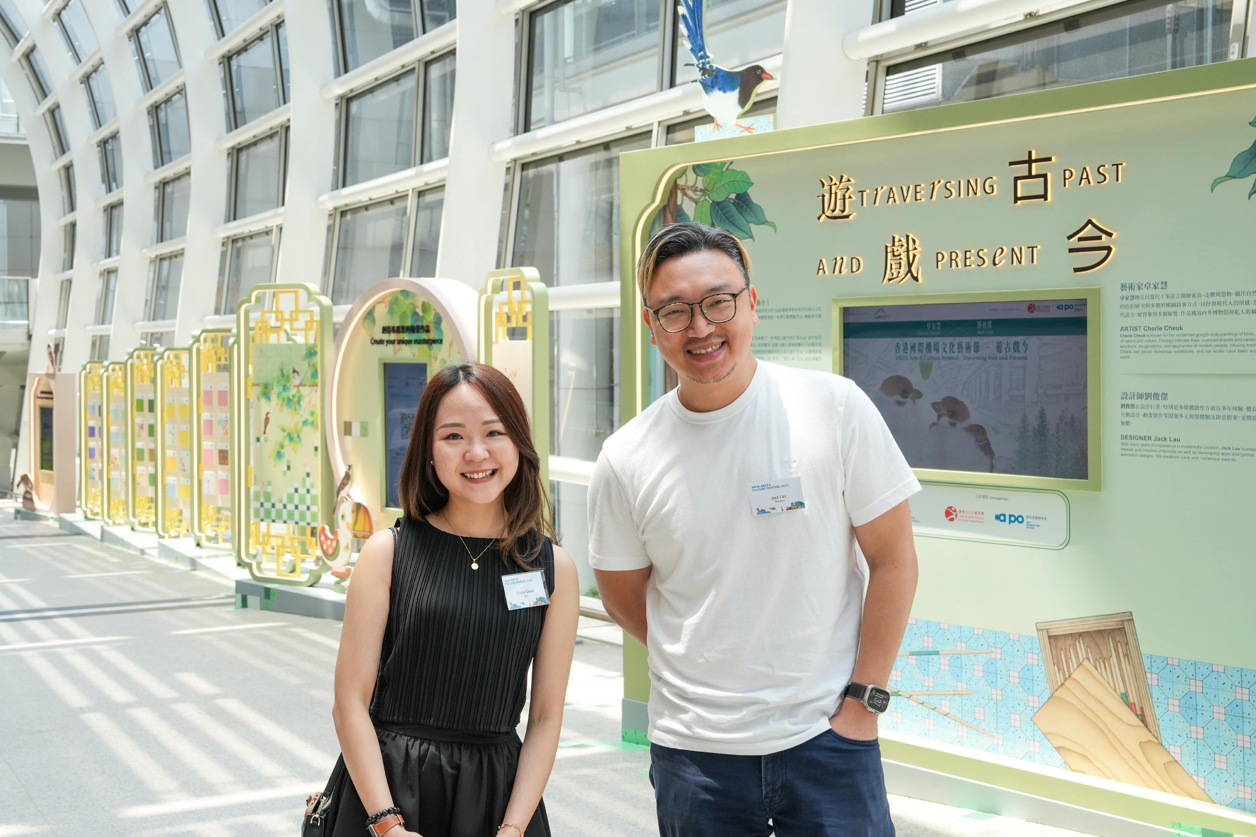 In collaboration with Hong Kong International Airport (HKIA), the Art Promotion Office under the Leisure and Cultural Services Department launched the "Traversing Past and Present" exhibition as part of the HKIA Arts & Culture Festival 2024. The exhibition is now on display from today (August 8) until October 31 at HKIA Terminal 1. Photo shows the two participating artists, Cherie Cheuk (left) and Jack Lau (right).