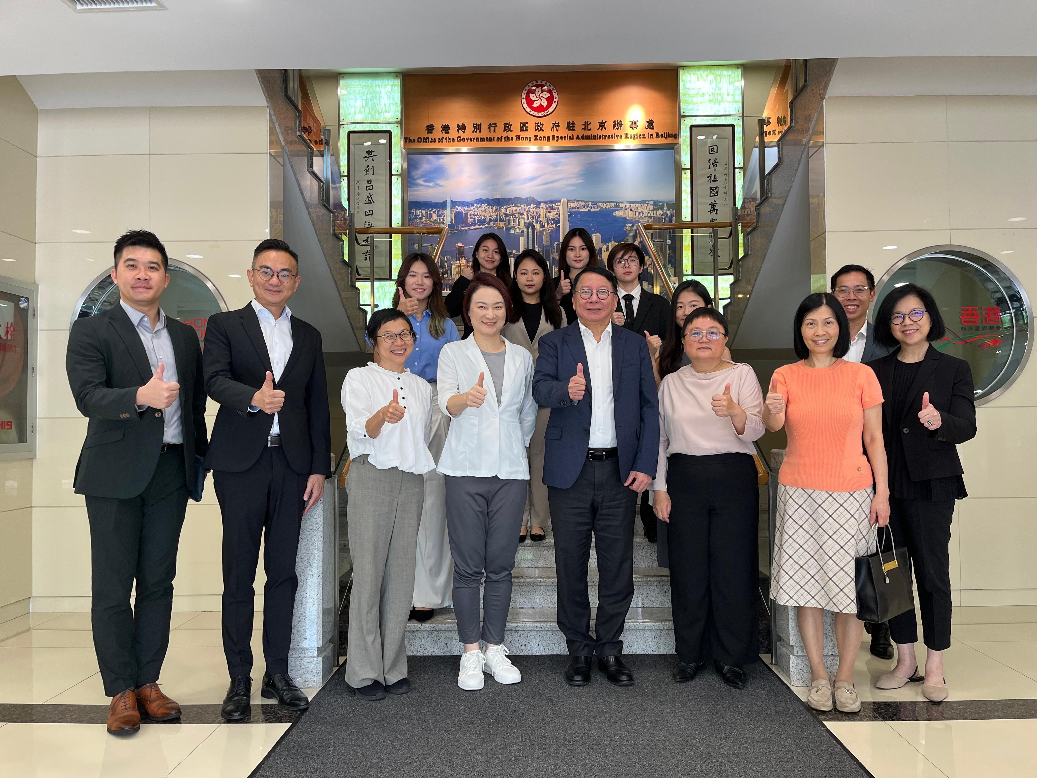 The Chief Secretary for Administration, Mr Chan Kwok-ki, and the Convenor of the Working Group on Patriotic Education, Ms Starry Lee, visited the Office of the Government of the Hong Kong Special Administrative Region in Beijing on August 8 during their visit in Beijing. Photo shows Mr Chan (front row, fourth right), Ms Lee (front row, fourth left) and staff of the Office, as well as Hong Kong students who are based in Beijing and currently interning at the Office.