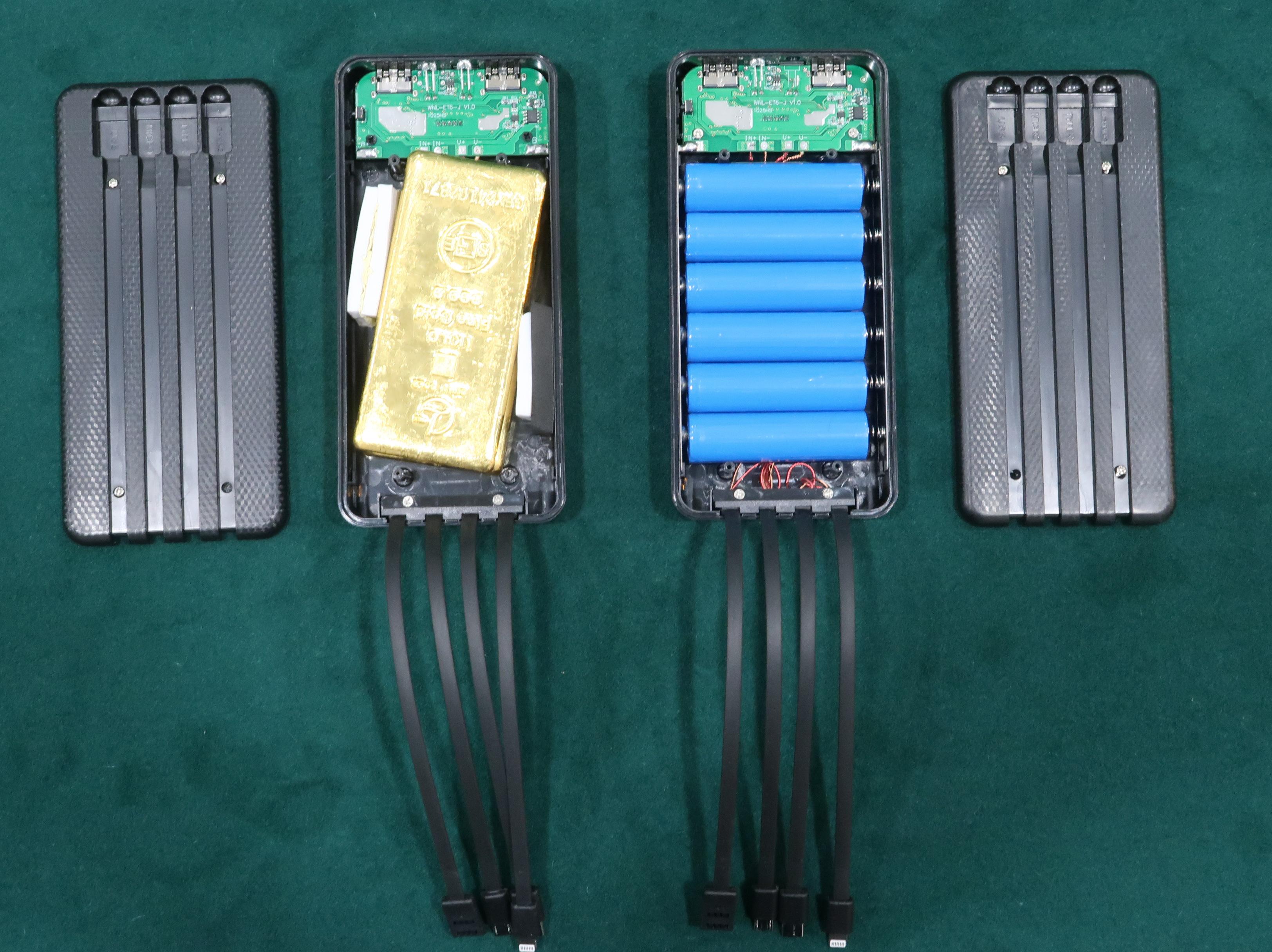 Hong Kong Customs yesterday (August 8) seized two suspected smuggled gold slabs, weighing about 2 kilograms in total, with an estimated market value of about $1.2 million at the Shenzhen Bay Control Point. Photo shows the suspected smuggled gold slabs concealed inside a portable charger.