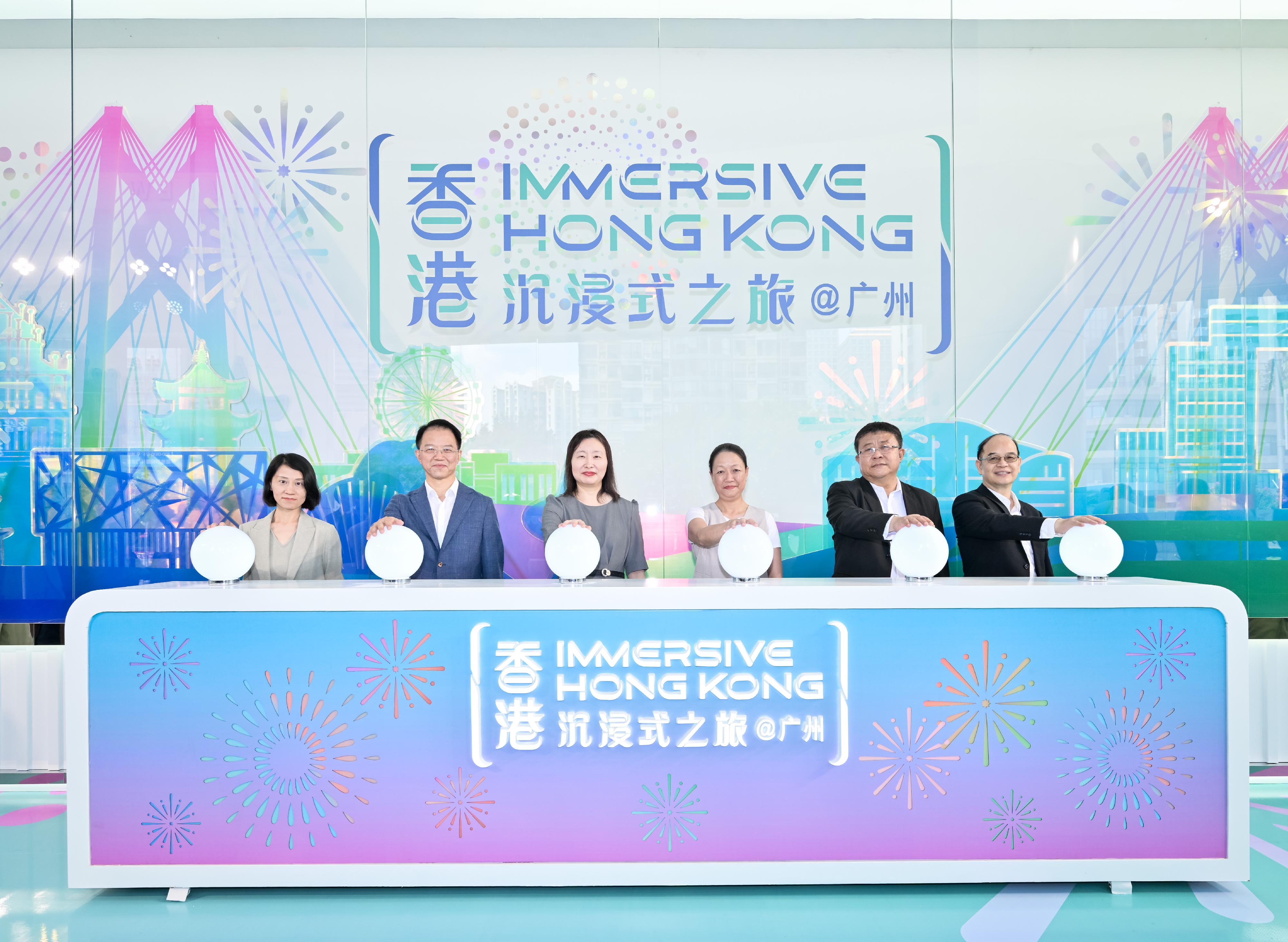 The "Immersive Hong Kong" roving exhibition, which showcases Hong Kong's new attractions, advantages and opportunities with art technology, opened in Guangzhou today (August 9) as one of the Hong Kong Special Administrative Region (HKSAR) Government's promotional events in the Guangdong-Hong Kong-Macao Greater Bay Area. Photo shows (from left) the Director, Southern China and Chief Representative of Guangzhou of the Hong Kong Tourism Board, Ms Orchid Yu; the Director-General and Inspector at Level 1 of the Hong Kong and Macao Affairs Office of the People's Government of Guangzhou Municipality, Mr Zhan Decun; the Director of the Hong Kong Economic and Trade Office in Guangdong, Miss Linda So; the Director of Information Services, Mrs Apollonia Liu; the Director-General of Guangdong Department of Liaison Office of the Central People's Government in the HKSAR, Mr Fan Kesheng; and Inspector at Level 2 of the Hong Kong and Macao Affairs Office of the People's Government of Guangdong Province Mr Ou Jianwei, officiating at the opening ceremony.