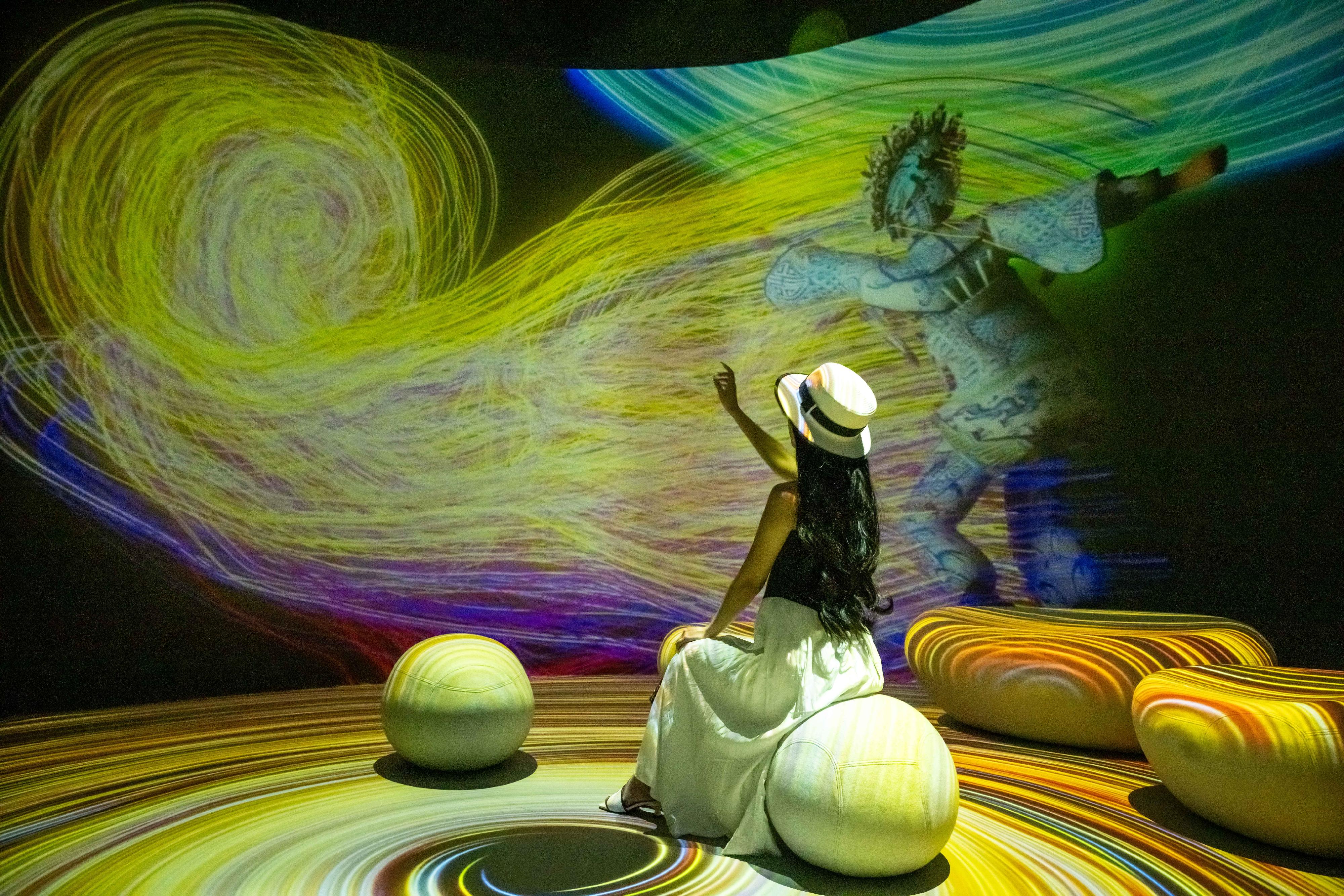 The "Immersive Hong Kong" roving exhibition, which showcases Hong Kong's new attractions, advantages and opportunities with art technology, opened in Guangzhou today (August 9) as one of the Hong Kong Special Administrative Region Government's promotional events in the Guangdong-Hong Kong-Macao Greater Bay Area. Photo shows an art projection with the theme "Blossoming Creativity" at the exhibition.