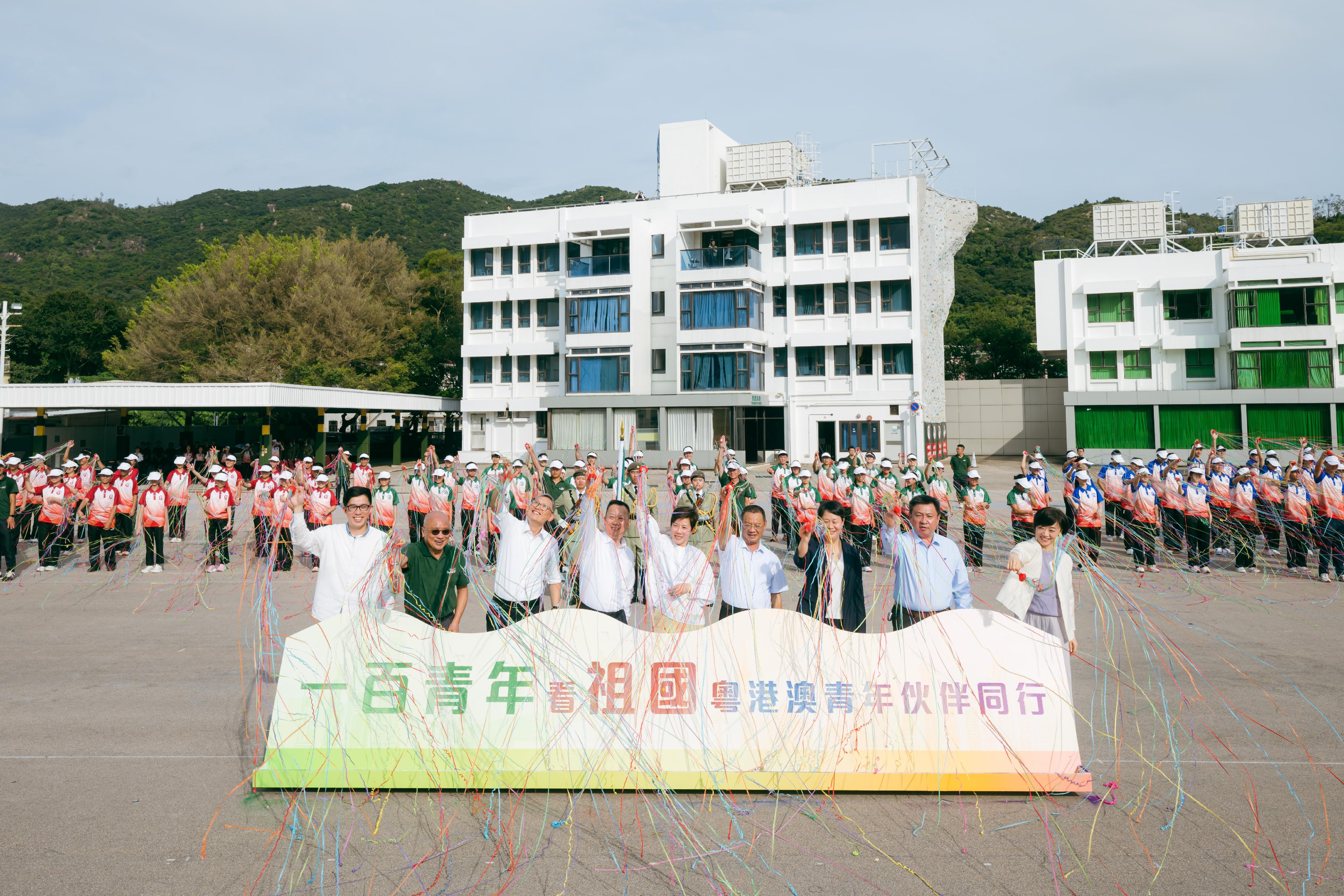 The Commissioner of Customs and Excise, Ms Louise Ho, today (August 10) officiated at the launching ceremony of "Customs YES Guangzhou, Hong Kong, Macao Exchange Tour for Hundred Youths" at the Hong Kong Customs College. Photo shows Ms Ho (first row, centre); the Director-General of the Macao Customs Service, Mr Vong Man-chong (first row, fourth left); Inspector at Level 2 of the Guangdong Sub-Administration of the General Administration of Customs of the People's Republic of China, Mr Yuan Shengqiang (first row, fourth right); the Under Secretary for Security, Mr Michael Cheuk (first row, third left); the Deputy Director of the Department of Youth Affairs of the Liaison Office of the Central People's Government in the Hong Kong Special Administrative Region, Mr Lo Chung-yeung (first row, first left) ; the Secretary-General of Guangzhou Youth Federation, Ms Lv Na (first row, first right); the Honorary Founding Executive Director of the Executive Committee of "Customs YES", Mr Edgar Kwan (first row, second left), and the Executive Director of the Executive Committee of "Customs YES", Dr Eugene Chan (first row, second right), at the launching ceremony.