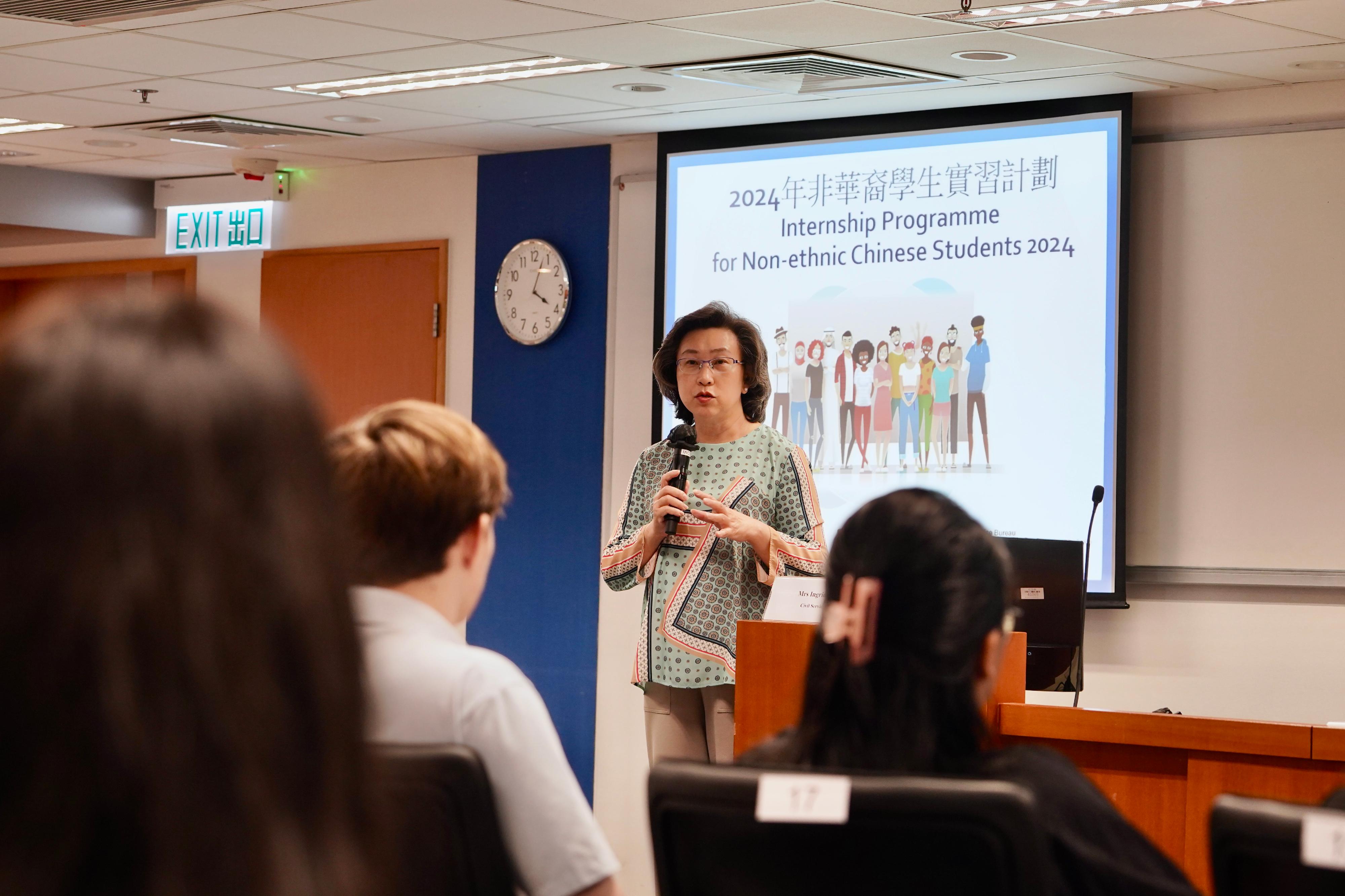 The Secretary for the Civil Service, Mrs Ingrid Yeung, attended a sharing session on the Internship Programme for Non-ethnic Chinese Students today (August 12). Photo shows Mrs Yeung  speaking to students and encouraging them to prepare for future employment.