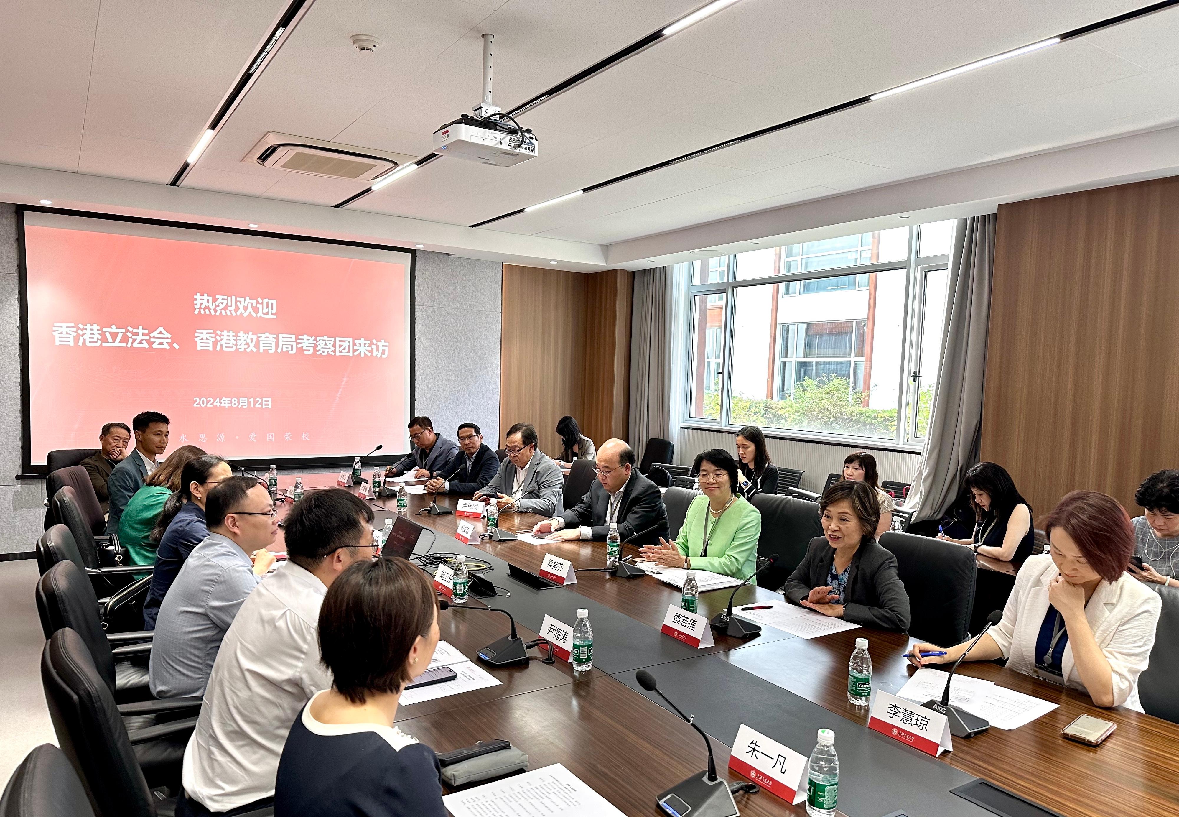 The Secretary for Education, Dr Choi Yuk-lin, together with the Legislative Council Panel on Education delegation, began a visit to Shanghai today (August 12). Photo shows Dr Choi (second right) and the delegation meeting Vice President of Shanghai Jiao Tong University Professor Liu Weidong (fifth left) and other representatives of the University.