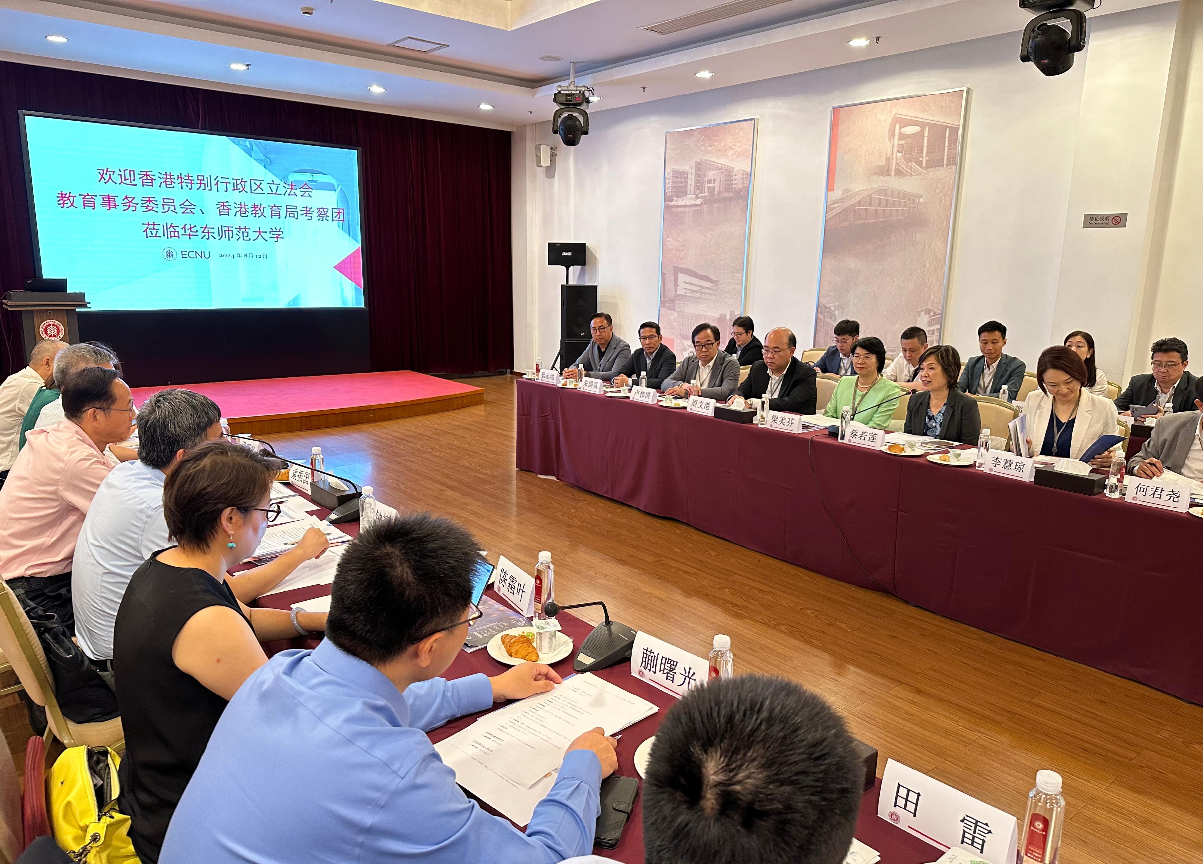 The Secretary for Education, Dr Choi Yuk-lin, together with the Legislative Council Panel on Education delegation, began a visit to Shanghai today (August 12). Photo shows Dr Choi (second right) and the delegation meeting representatives of East China Normal University.